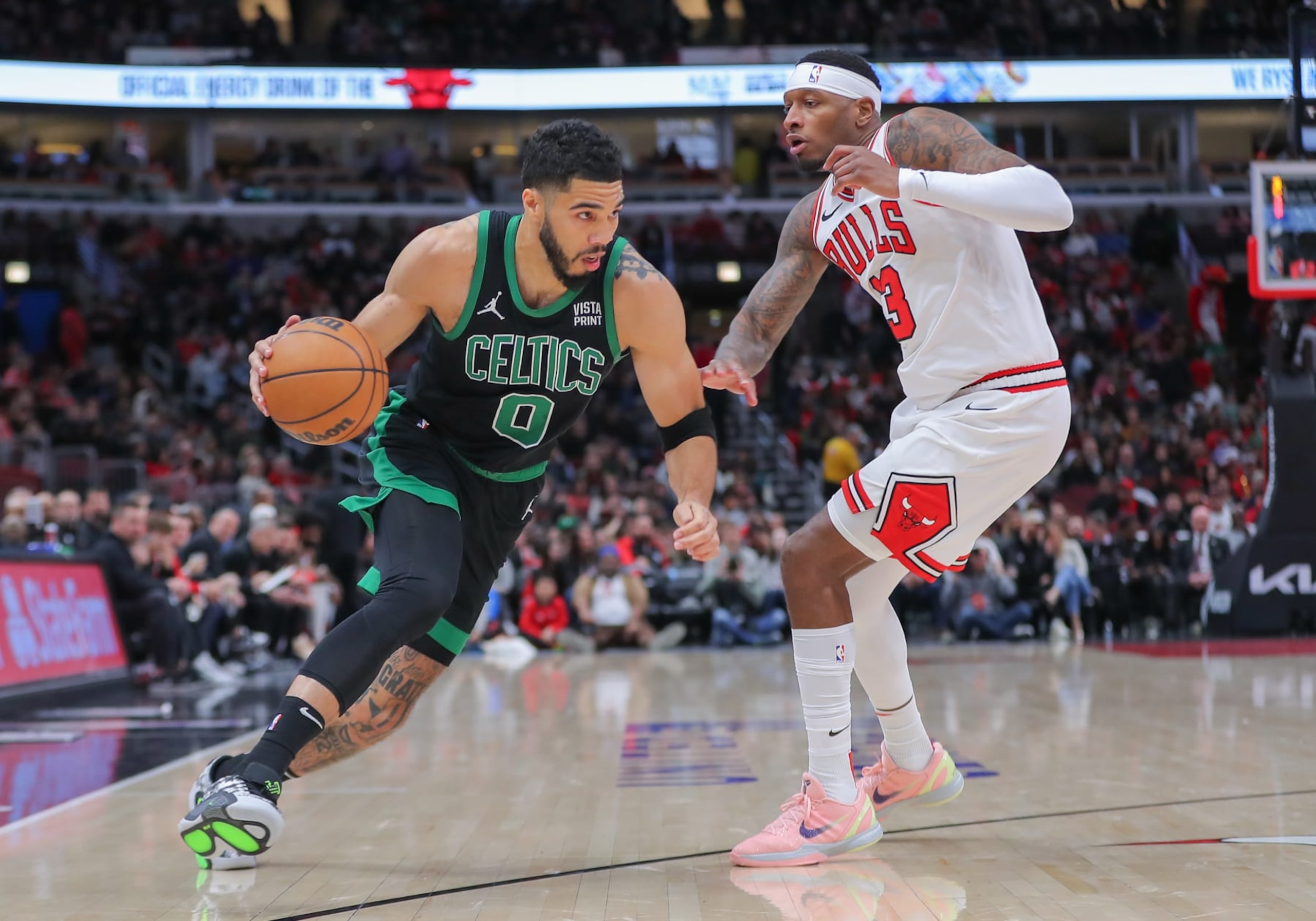 CHICAGO, IL - MARCH 23: Torrey Craig #13 of the Chicago Bulls guards Jayson Tatum #0 of the Boston Celtics during the first half at the United Center on March 23, 2024 in Chicago, Illinois. (Photo by Melissa Tamez/Icon Sportswire via Getty Images)