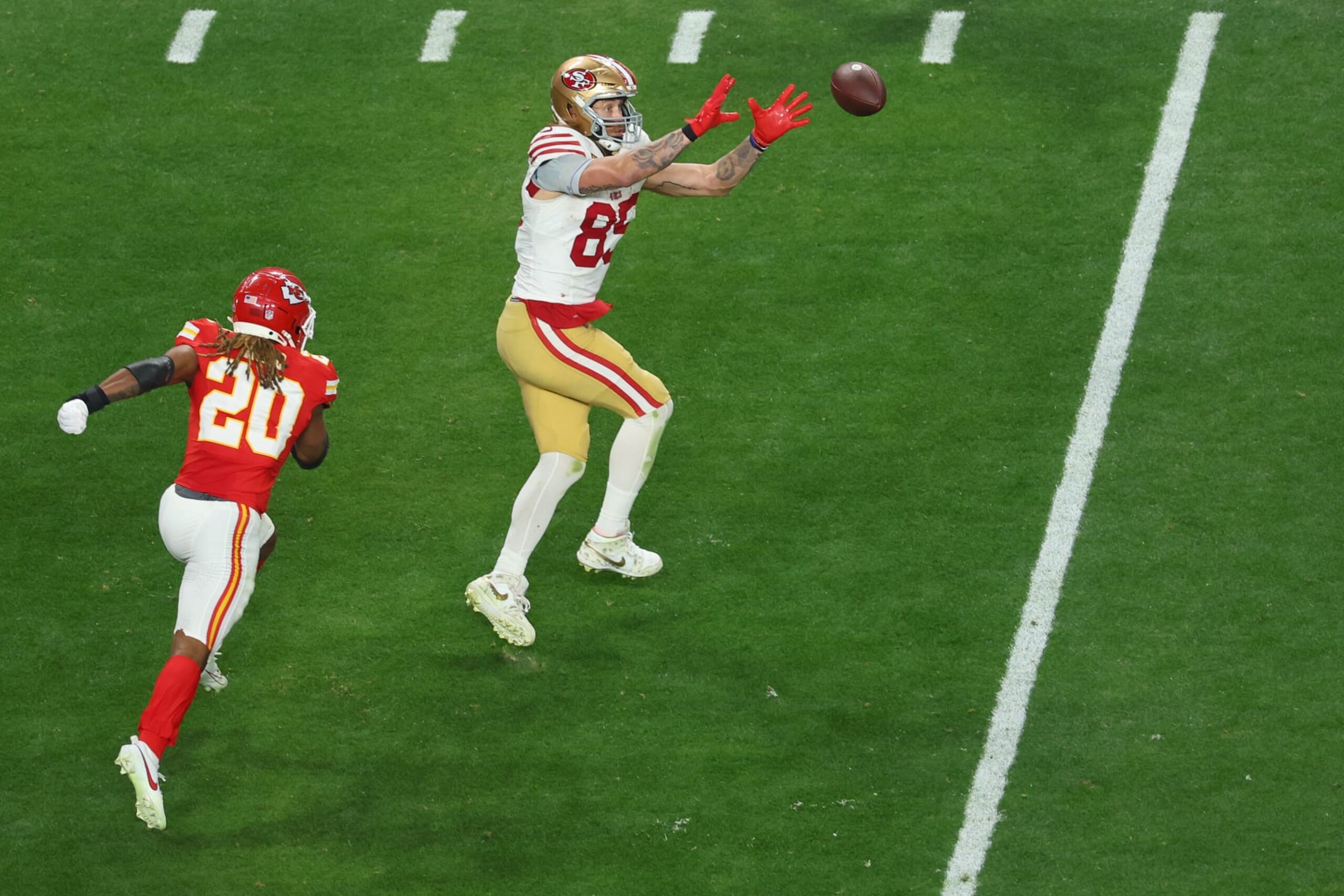 LAS VEGAS, NEVADA - FEBRUARY 11: George Kittle #85 of the San Francisco 49ers catches a pass against Justin Reid #20 of the Kansas City Chiefs in the fourth quarter during Super Bowl LVIII at Allegiant Stadium on February 11, 2024 in Las Vegas, Nevada. (Photo by Michael Reaves/Getty Images)