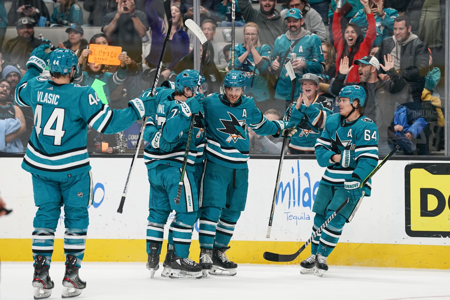 SAN JOSE, CA - APRIL 13: Mario Ferraro #38, Mikael Granlund #64 and Fabian Zetterlund #20 of the San Jose Sharks celebrate scoring a goal in the second period against the Minnesota Wild at SAP Center on April 13, 2024 in San Jose, California. (Photo by Kavin Mistry/NHLI via Getty Images)