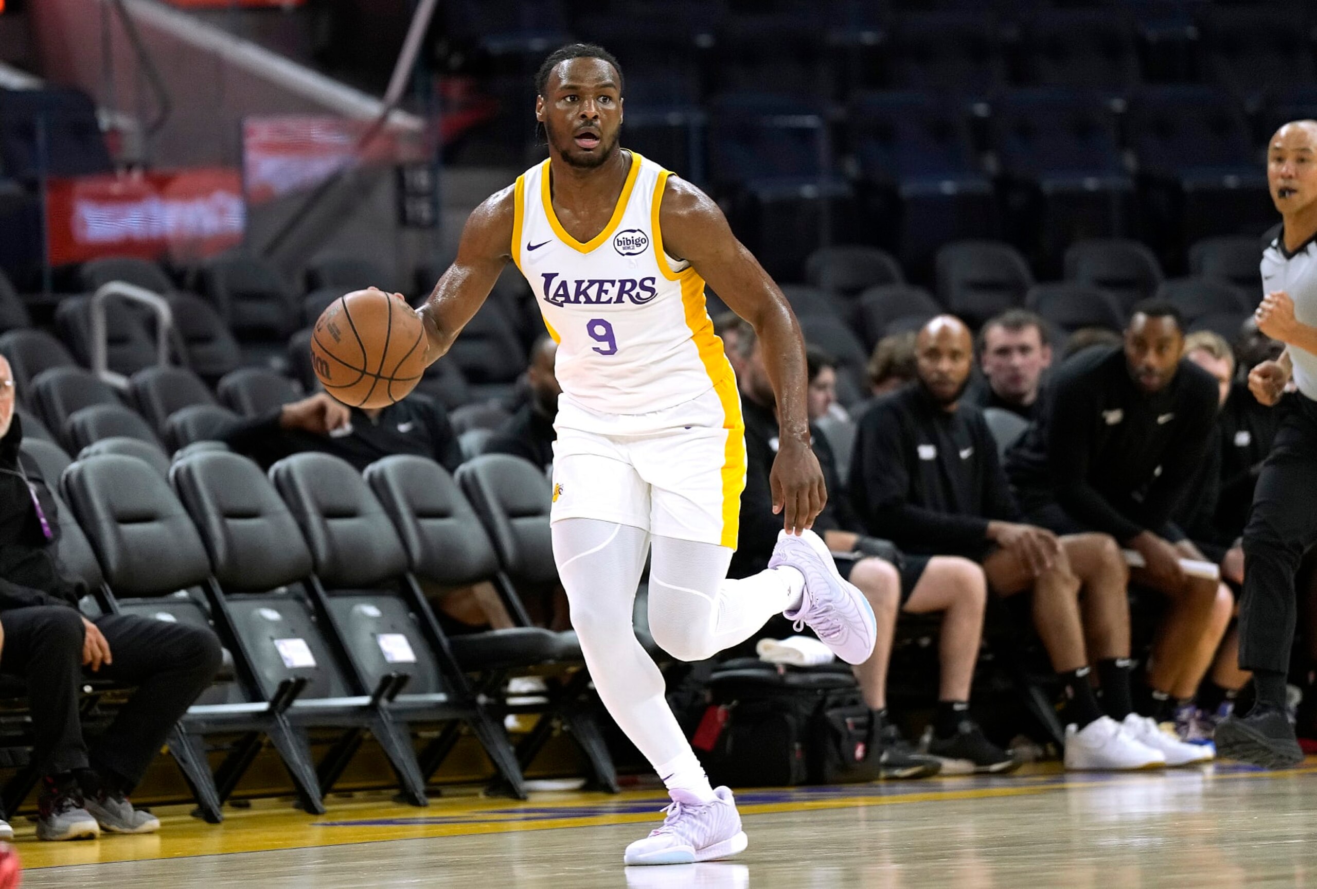 SAN FRANCISCO, CALIFORNIA - JULY 10: Bronny James Jr. #9 of the Los Angeles Lakers dribbles the ball up court against the Miami Heat during the first half of the 2024 California Classic at Chase Center on July 10, 2024 in San Francisco, California. NOTE TO USER: User expressly acknowledges and agrees that, by downloading and or using this photograph, User is consenting to the terms and conditions of the Getty Images License Agreement. (Photo by Thearon W. Henderson/Getty Images) SAN FRANCISCO, CALIFORNIA - JULY 10: Bronny James Jr. #9 of the Los Angeles Lakers dribbles the ball up court against the Miami Heat during the first half of the 2024 California Classic at Chase Center on July 10, 2024 in San Francisco, California. NOTE TO USER: User expressly acknowledges and agrees that, by downloading and or using this photograph, User is consenting to the terms and conditions of the Getty Images License Agreement. (Photo by Thearon W. Henderson/Getty Images)