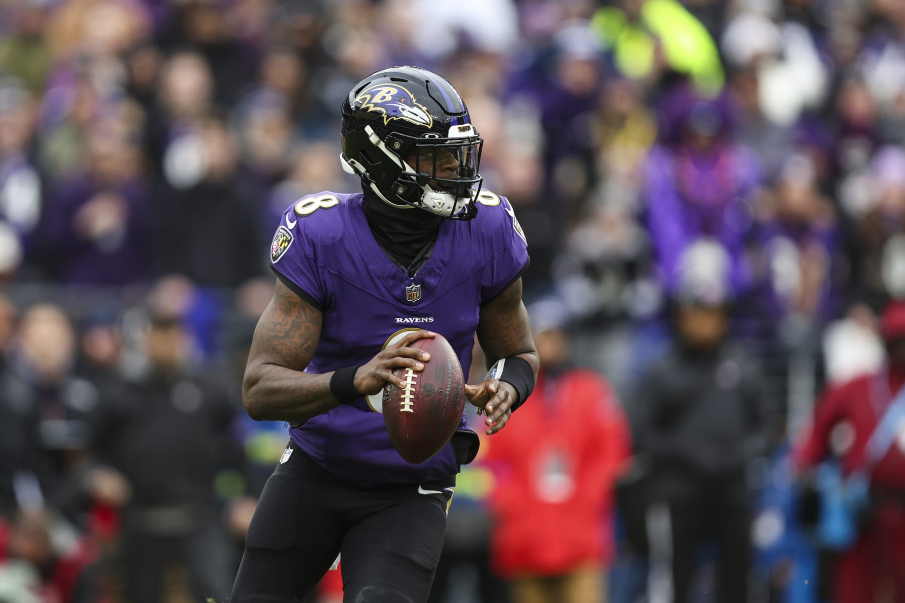 BALTIMORE, MD - JANUARY 28: Lamar Jackson #8 of the Baltimore Ravens drops back to pass during the AFC Championship NFL football game against the Kansas City Chiefs at M&T Bank Stadium on January 28, 2024 in Baltimore, Maryland. (Photo by Perry Knotts/Getty Images)