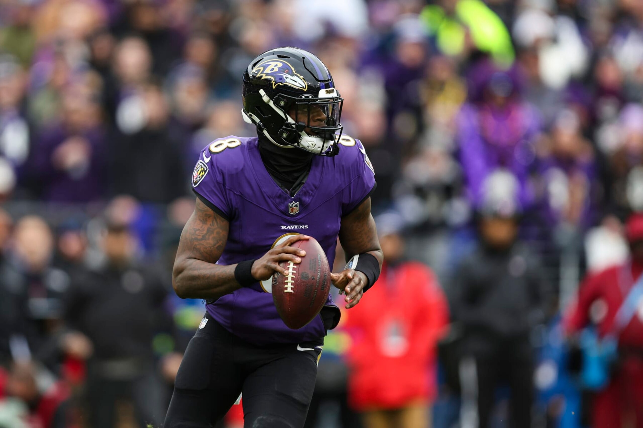BALTIMORE, MD - JANUARY 28: Lamar Jackson #8 of the Baltimore Ravens drops back to pass during the AFC Championship NFL football game against the Kansas City Chiefs at M&T Bank Stadium on January 28, 2024 in Baltimore, Maryland. (Photo by Perry Knotts/Getty Images)