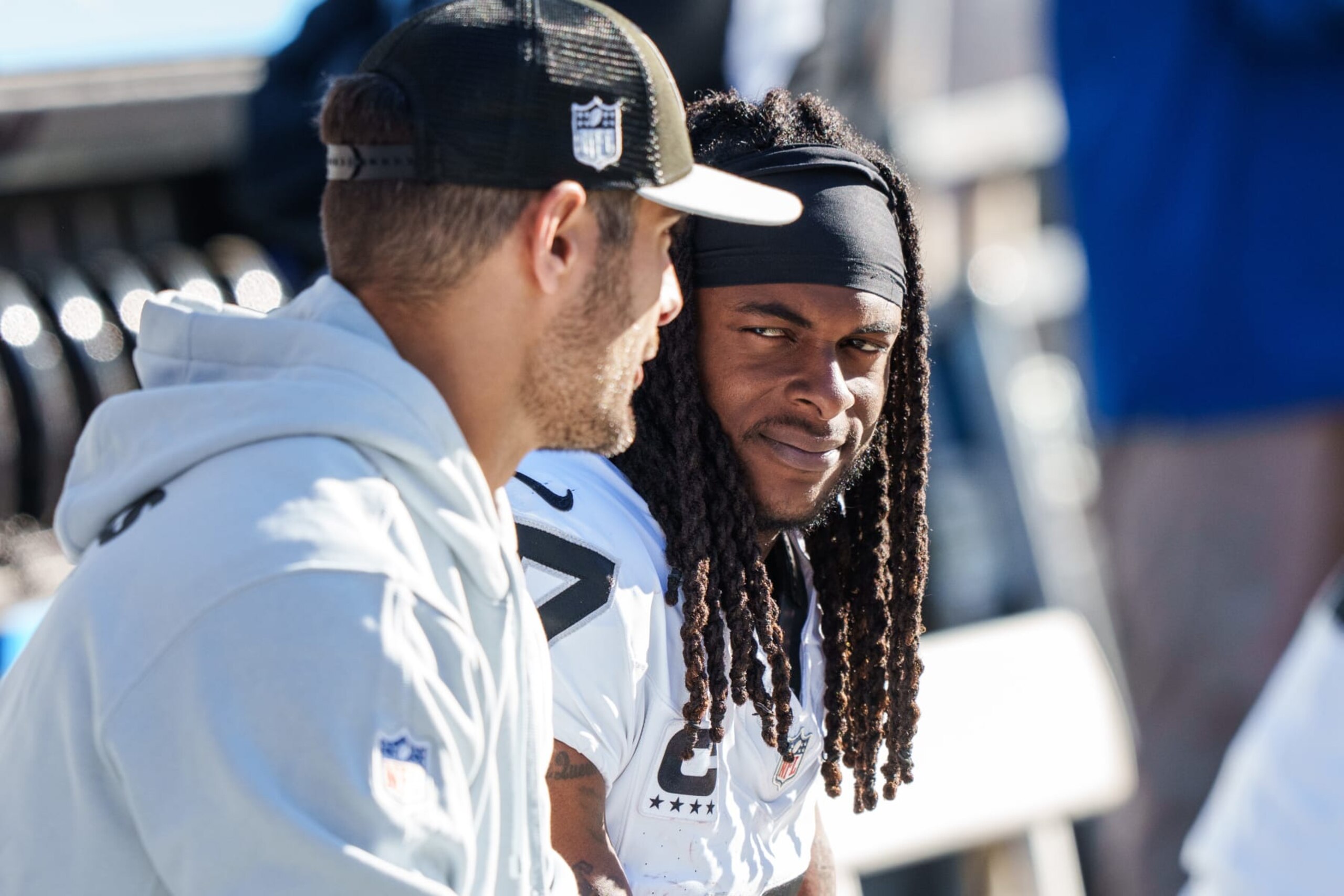 CHICAGO, IL - OCTOBER 22:  Wide receiver Davante Adams #17 of the Las Vegas Raiders talks with quarterback Jimmy Garoppolo #10 on the sideline during an NFL football game against the Chicago Bears at Soldier Field on October 22, 2023 in Chicago, Illinois. (Photo by Todd Rosenberg/Getty Images)