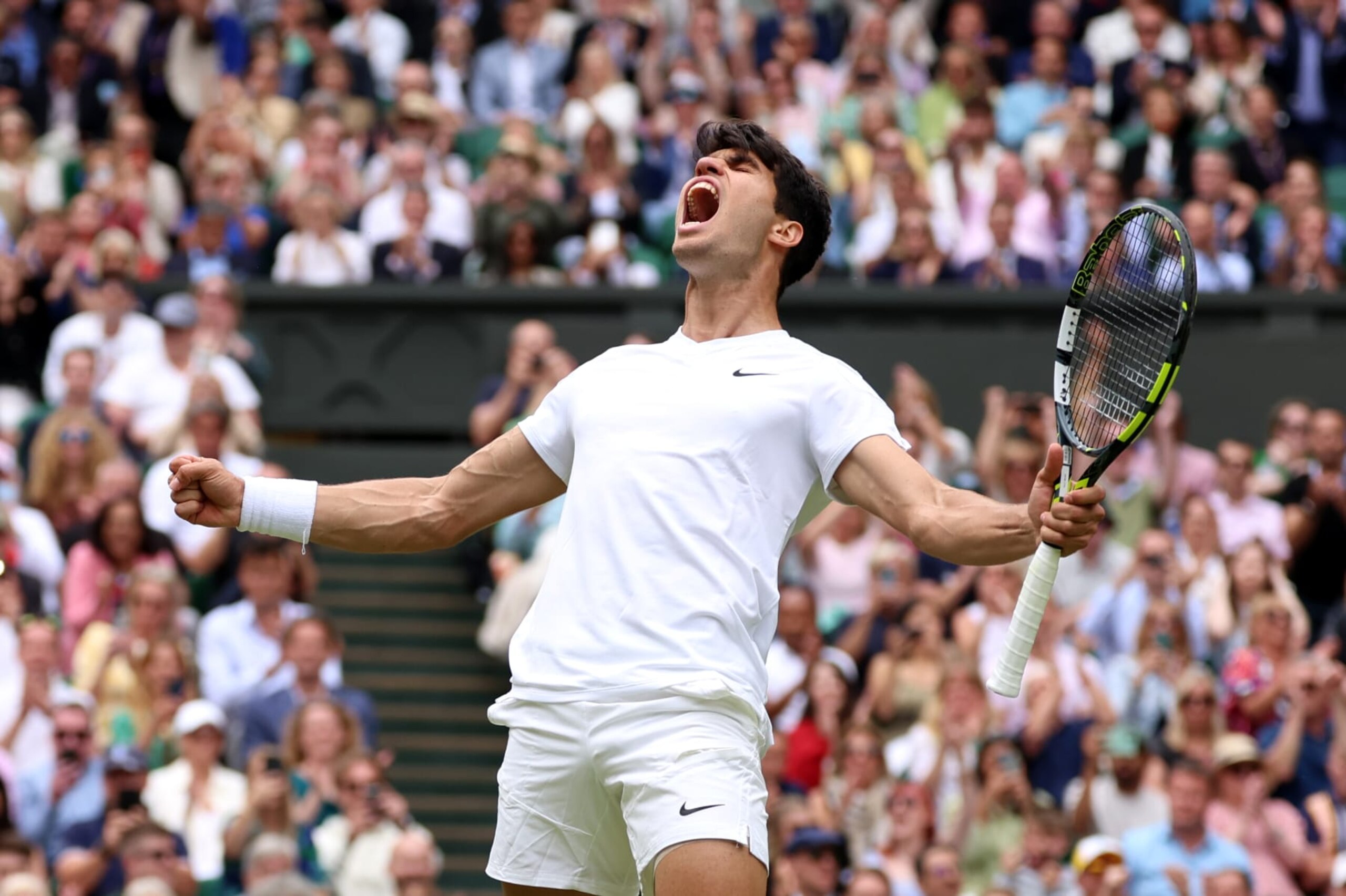 LONDON, ENGLAND - JULY 12: Carlos Alcaraz of Spain celebrates winning match point against Daniil Medvedev in the Men's Singles Semi-Final match during day twelve of The Championships Wimbledon 2024 at All England Lawn Tennis and Croquet Club on July 12, 2024 in London, England. (Photo by Sean M. Haffey/Getty Images)