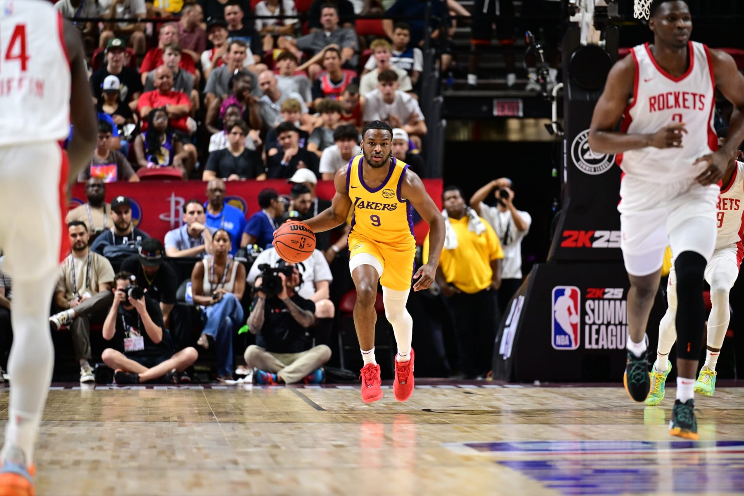 LAS VEGAS, NV - JULY 12: Bronny James Jr. #9 of the Los Angeles Lakers dribbles the ball during the game against the Houston Rockets on July 12, 2024 at the Thomas & Mack Center in Las Vegas, Nevada. NOTE TO USER: User expressly acknowledges and agrees that, by downloading and or using this photograph, User is consenting to the terms and conditions of the Getty Images License Agreement. Mandatory Copyright Notice: Copyright 2024 NBAE (Photo by Adam Hagy/NBAE via Getty Images) LAS VEGAS, NV - JULY 12: Bronny James Jr. #9 of the Los Angeles Lakers dribbles the ball during the game against the Houston Rockets on July 12, 2024 at the Thomas & Mack Center in Las Vegas, Nevada. NOTE TO USER: User expressly acknowledges and agrees that, by downloading and or using this photograph, User is consenting to the terms and conditions of the Getty Images License Agreement. Mandatory Copyright Notice: Copyright 2024 NBAE (Photo by Adam Hagy/NBAE via Getty Images)