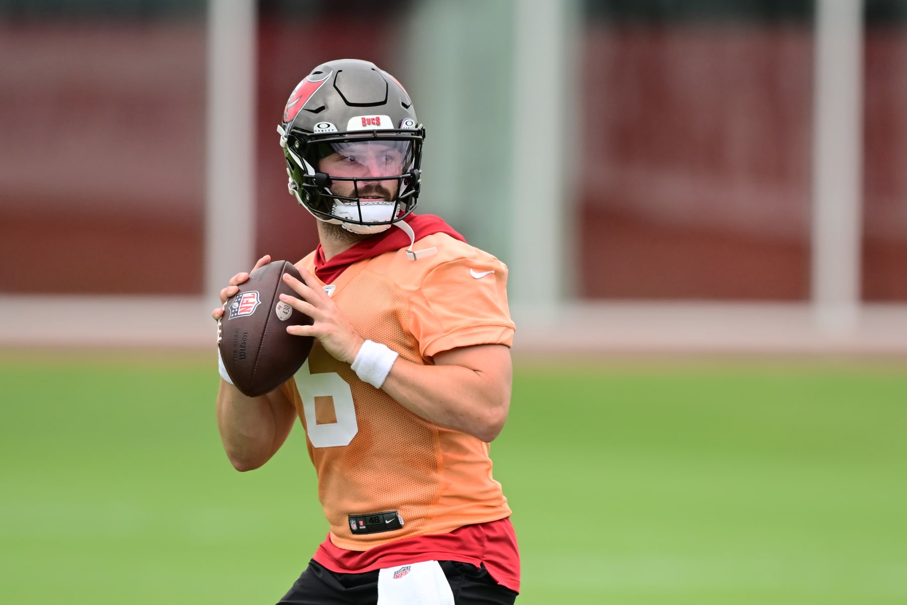 TAMPA, FLORIDA - JUNE 11: Baker Mayfield #6 of the Tampa Bay Buccaneers looks to throw a pass during the Buccaneers Mandatory Minicamp at AdventHealth Training Center on June 11, 2024 in Tampa, Florida. (Photo by Julio Aguilar/Getty Images)