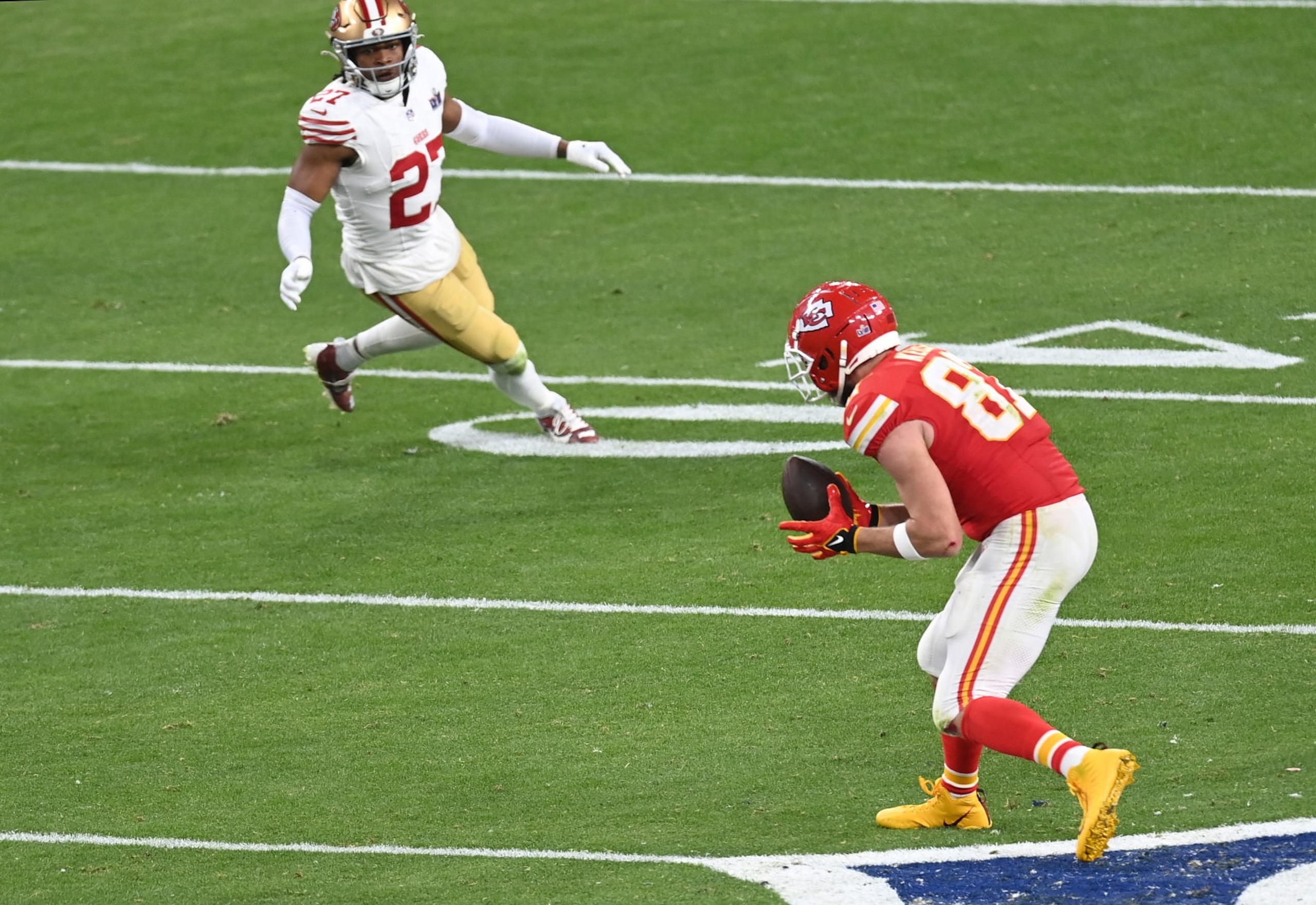 LAS VEGAS, NEVADA - FEBRUARY 11: Travis Kelce #87 of the Kansas City Chiefs catches a pass against the San Francisco 49ers in overtime during Super Bowl LVIII at Allegiant Stadium on February 11, 2024 in Las Vegas, Nevada. (Photo by Focus on Sport/Getty Images)