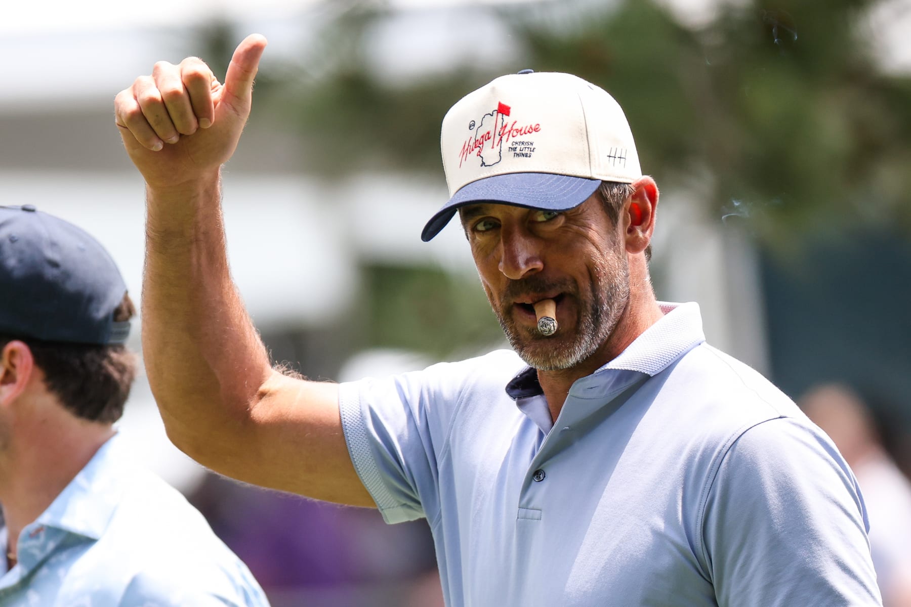 STATELINE, NEVADA - JULY 12: NFL football player Aaron Rodgers gives a thumbs up to the crowd at the 15th hole on day one of the 2024 American Century Championship at Edgewood Tahoe Golf Course on July 12, 2024 in Stateline, Nevada. (Photo by Isaiah Vazquez/Getty Images)