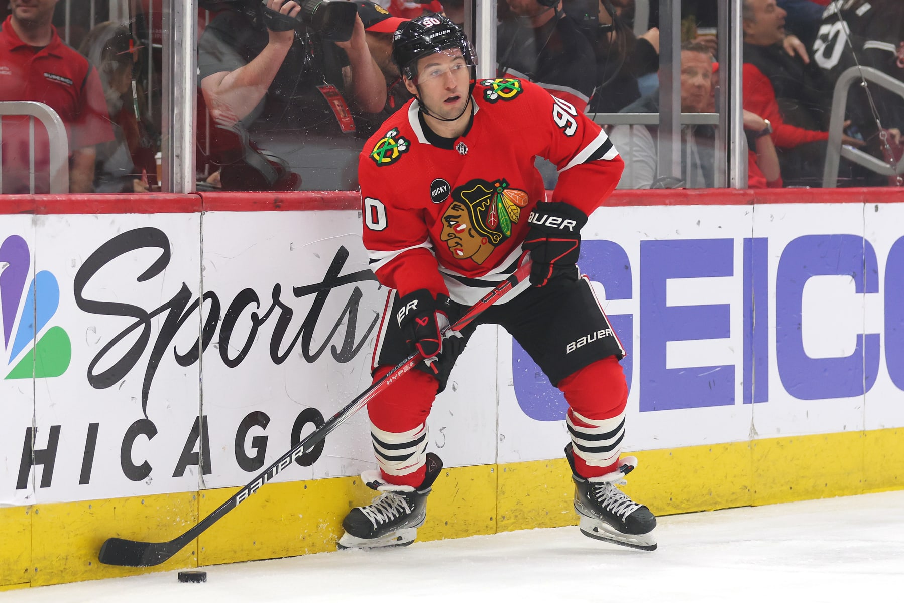 CHICAGO, ILLINOIS - APRIL 14: Tyler Johnson #90 of the Chicago Blackhawks skates with the puck against the Carolina Hurricanes during the first period at the United Center on April 14, 2024 in Chicago, Illinois. (Photo by Michael Reaves/Getty Images)