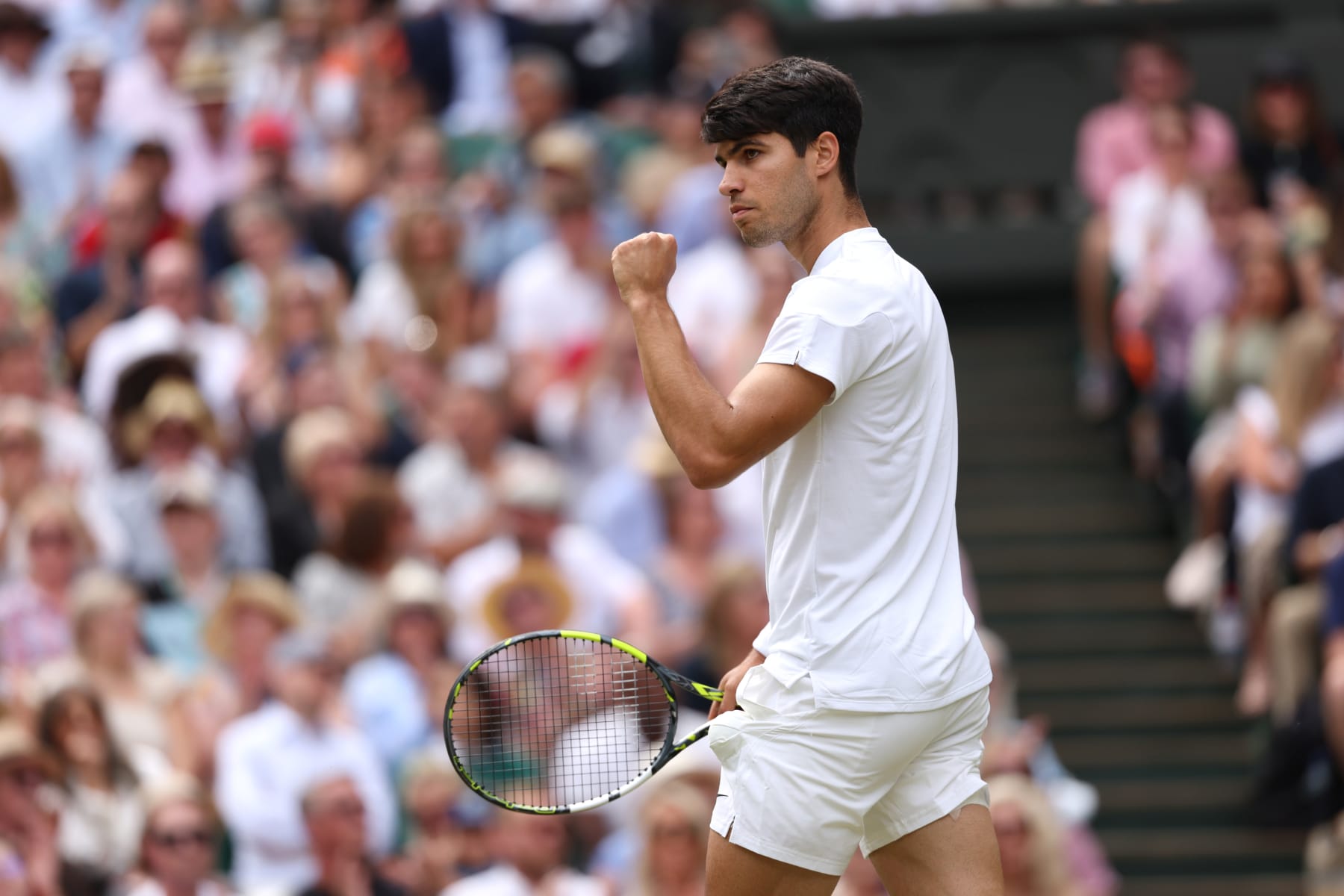 LONDON, ENGLAND - JULY 14: Carlos Alcaraz of Spain celebrates winning the second set as he plays against Novak Djokovic of Serbia in the Gentlemen's Singles Final during day fourteen of The Championships Wimbledon 2024 at All England Lawn Tennis and Croquet Club on July 14, 2024 in London, England. (Photo by Clive Brunskill/Getty Images)