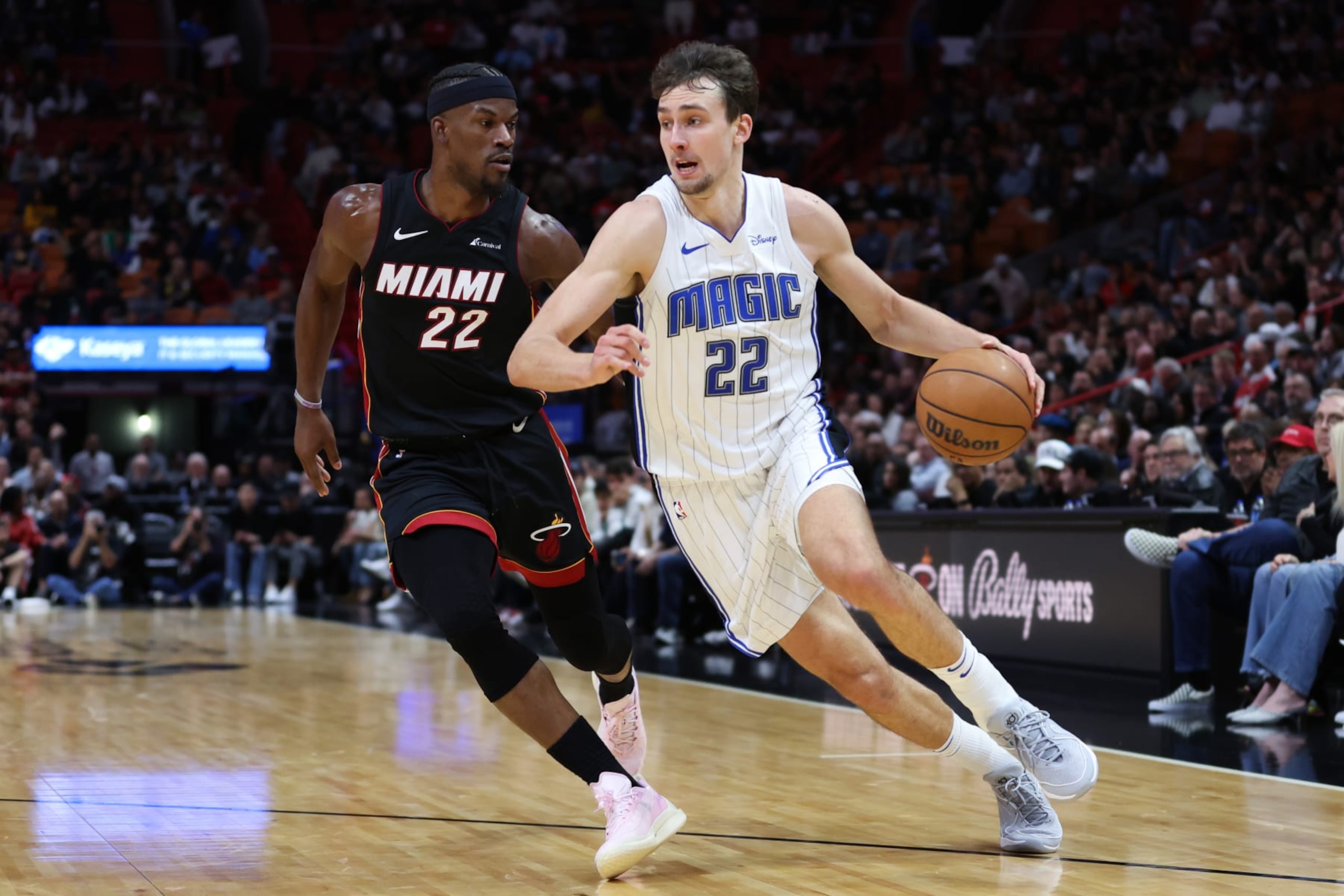MIAMI, FLORIDA - FEBRUARY 06: Franz Wagner #22 of the Orlando Magic drives against Jimmy Butler #22 of the Miami Heat during the second quarter of the game at Kaseya Center on February 06, 2024 in Miami, Florida. NOTE TO USER: User expressly acknowledges and agrees that, by downloading and or using this photograph, User is consenting to the terms and conditions of the Getty Images License Agreement. (Photo by Megan Briggs/Getty Images) MIAMI, FLORIDA - FEBRUARY 06: Franz Wagner #22 of the Orlando Magic drives against Jimmy Butler #22 of the Miami Heat during the second quarter of the game at Kaseya Center on February 06, 2024 in Miami, Florida. NOTE TO USER: User expressly acknowledges and agrees that, by downloading and or using this photograph, User is consenting to the terms and conditions of the Getty Images License Agreement. (Photo by Megan Briggs/Getty Images)
