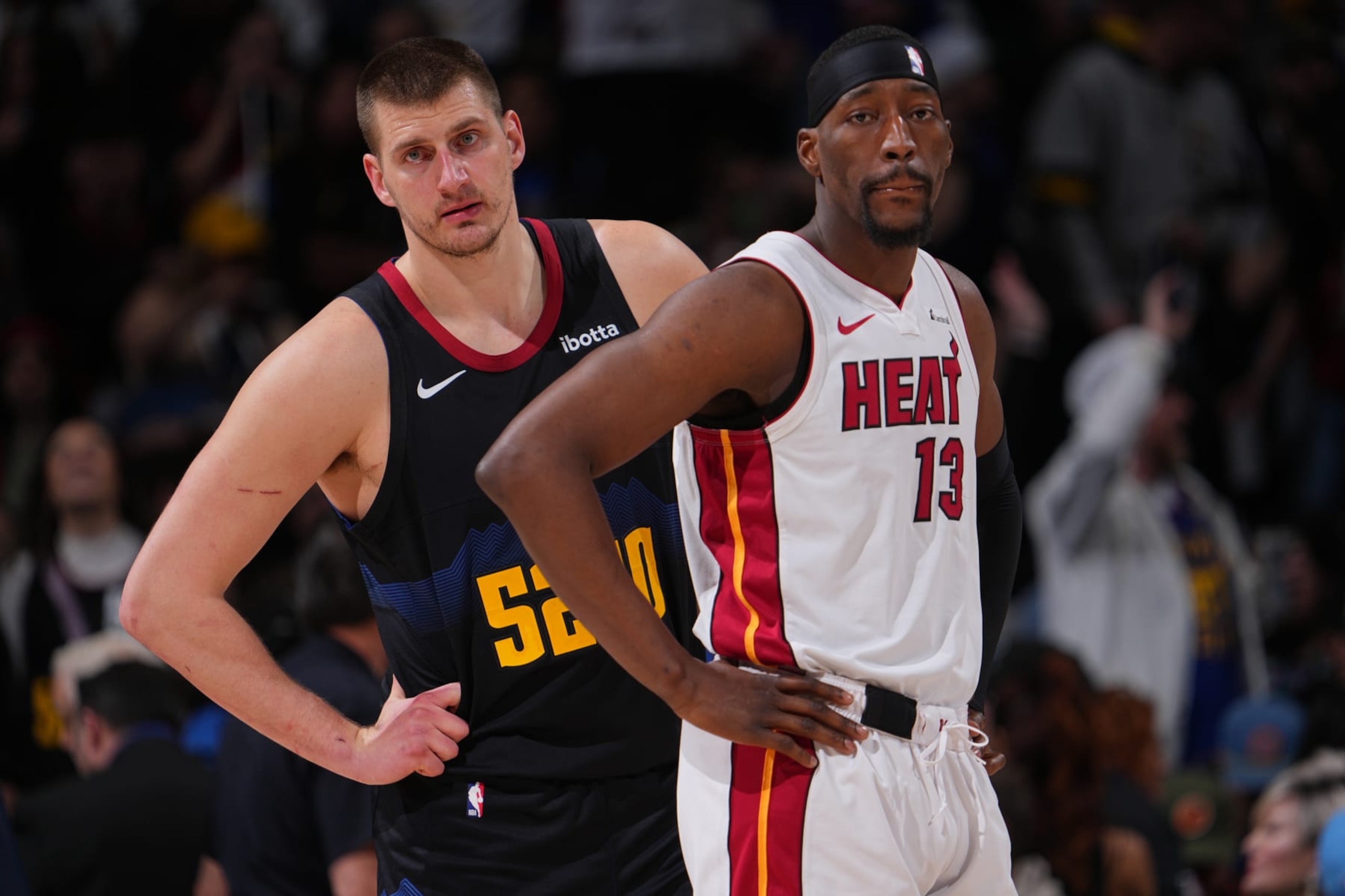DENVER, CO - FEBRUARY 29: Bam Adebayo #13 of the Miami Heat and Nikola Jokic #15 of the Denver Nuggets look on during the game on February 29, 2024 at the Ball Arena in Denver, Colorado. NOTE TO USER: User expressly acknowledges and agrees that, by downloading and/or using this Photograph, user is consenting to the terms and conditions of the Getty Images License Agreement. Mandatory Copyright Notice: Copyright 2024 NBAE (Photo by Bart Young/NBAE via Getty Images) DENVER, CO - FEBRUARY 29: Bam Adebayo #13 of the Miami Heat and Nikola Jokic #15 of the Denver Nuggets look on during the game on February 29, 2024 at the Ball Arena in Denver, Colorado. NOTE TO USER: User expressly acknowledges and agrees that, by downloading and/or using this Photograph, user is consenting to the terms and conditions of the Getty Images License Agreement. Mandatory Copyright Notice: Copyright 2024 NBAE (Photo by Bart Young/NBAE via Getty Images)