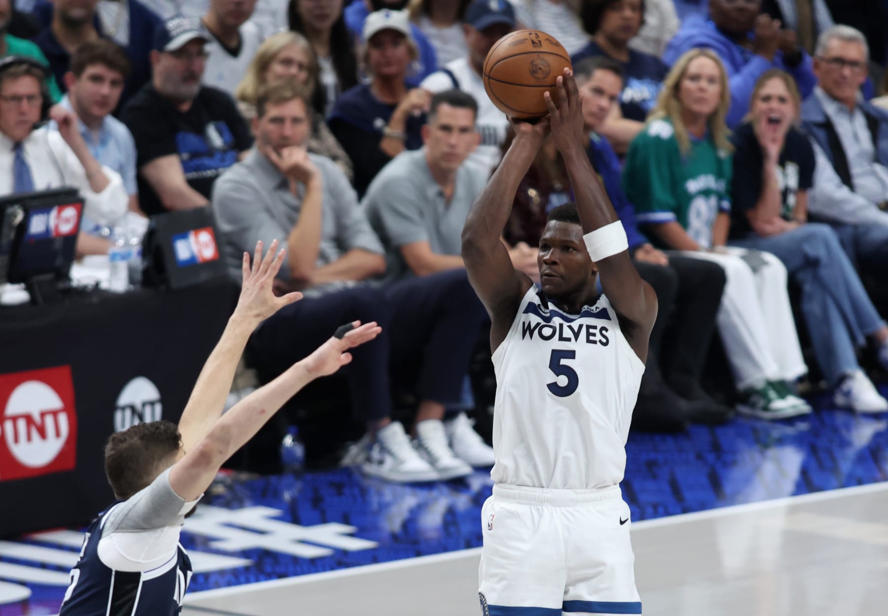 DALLAS, TEXAS - MAY 28:  Anthony Edwards #5 of the Minnesota Timberwolves attempts a jump shot against the Dallas Mavericks during the third quarter in Game Four of the Western Conference Finals at American Airlines Center on May 28, 2024 in Dallas, Texas. NOTE TO USER: User expressly acknowledges and agrees that, by downloading and or using this photograph, User is consenting to the terms and conditions of the Getty Images License Agreement. (Photo by Tim Heitman/Getty Images)