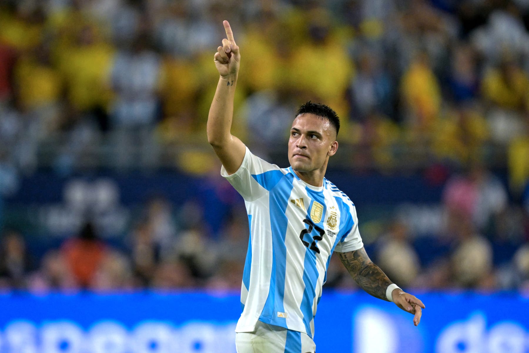 TOPSHOT - Argentina's forward #22 Lautaro Martinez celebrates scoring his team's first goal during the Conmebol 2024 Copa America tournament final football match between Argentina and Colombia at the Hard Rock Stadium, in Miami, Florida on July 14, 2024. (Photo by JUAN MABROMATA / AFP) (Photo by JUAN MABROMATA/AFP via Getty Images)