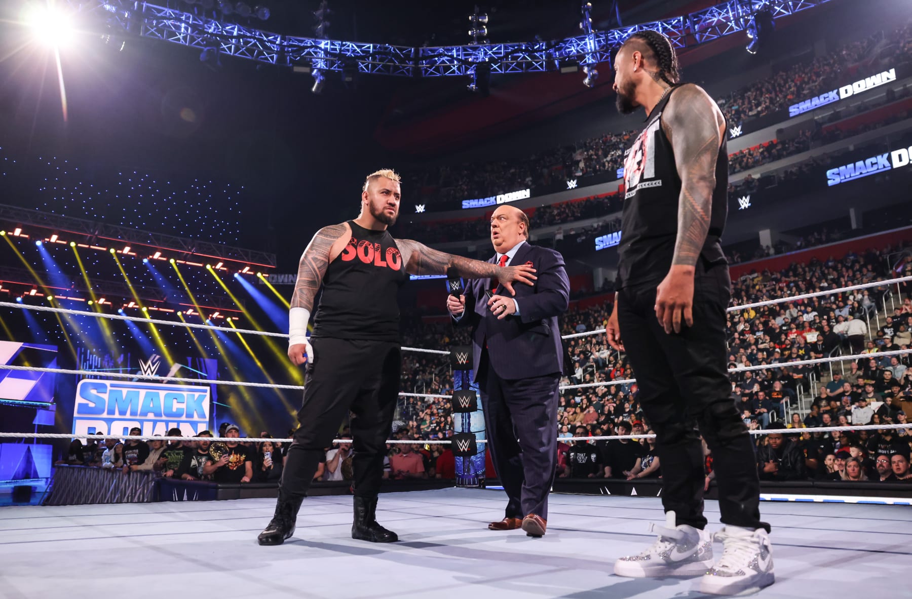 DETROIT, MICHIGAN - APRIL 12: Solo Sikoa speaks with Paul Heyman and Jimmy Uso during Friday Night Smackdown at Little Caesars Arena on April 12, 2024 in Detroit, Michigan. (Photo by WWE/Getty Images)