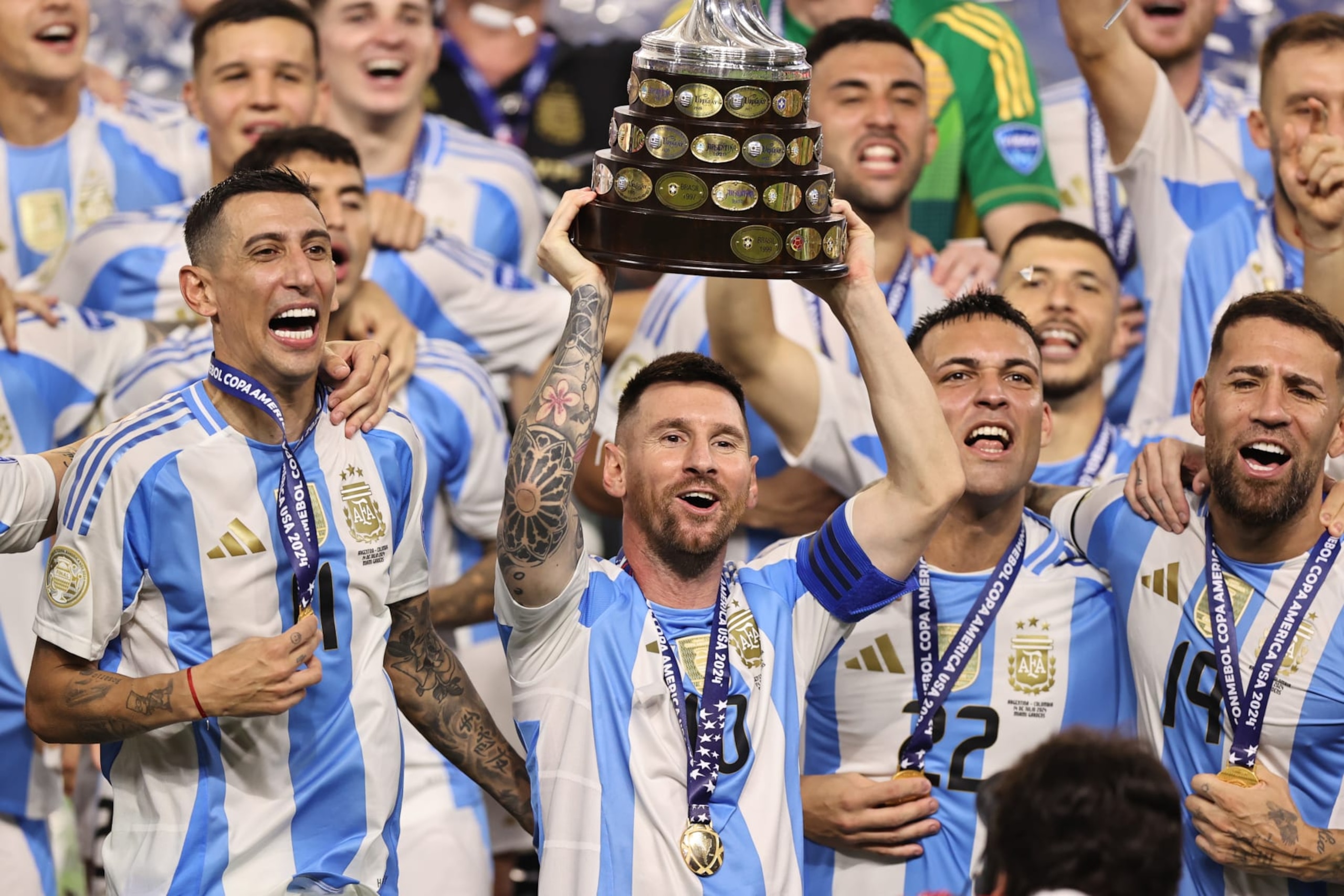 MIAMI GARDENS, FLORIDA - JULY 14: Lionel Messi of Argentina celebrates with the trophy after the team's victory during the CONMEBOL Copa America 2024 Final match between Argentina and Colombia at Hard Rock Stadium on July 14, 2024 in Miami Gardens, Florida. (Photo by Omar Vega/Getty Images)