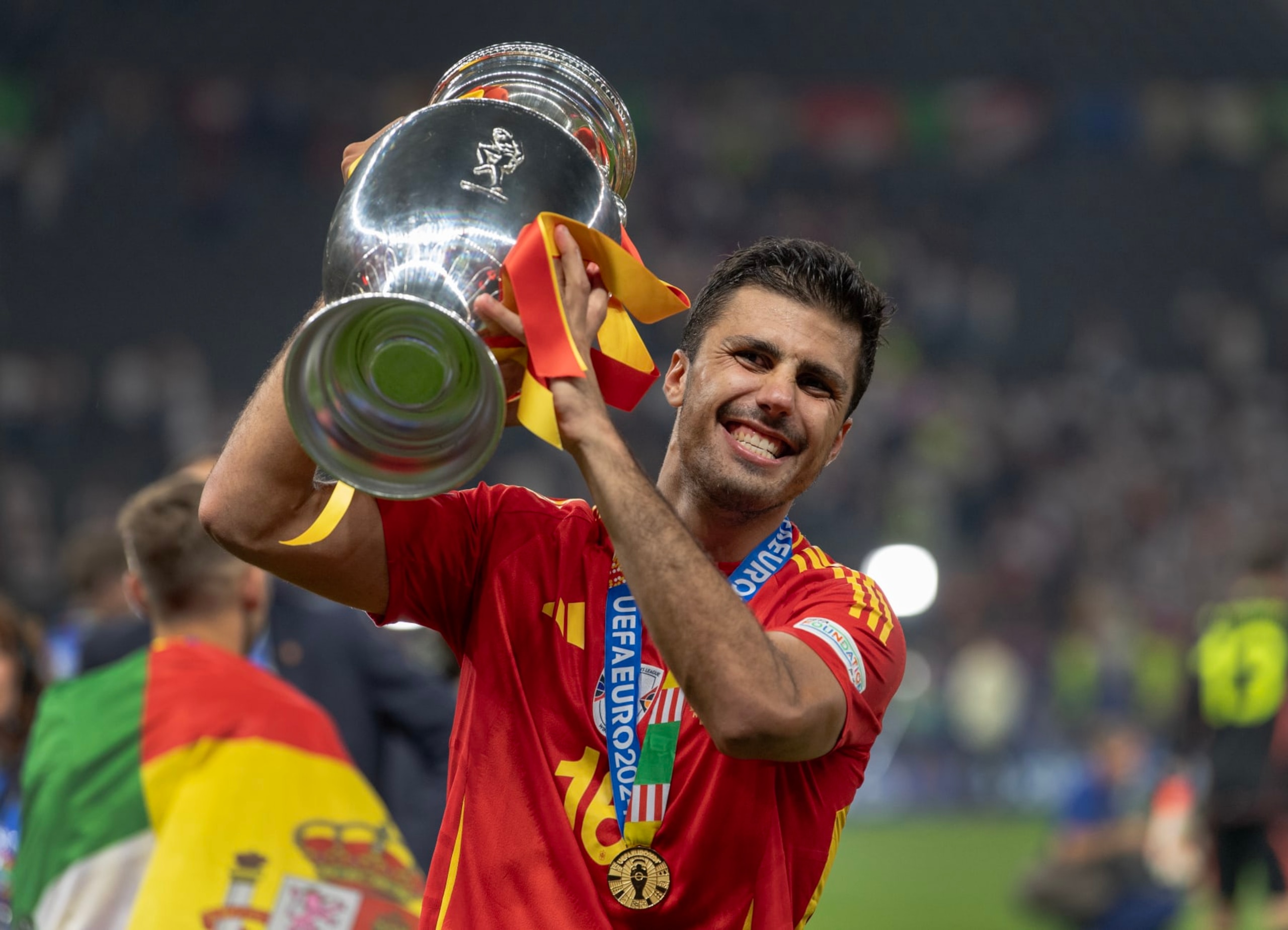 BERLIN, GERMANY - JULY 14: Rodri of Spain celebrates with the trophy after the UEFA EURO 2024 final match between Spain and England at Olympiastadion on July 14, 2024 in Berlin, Germany. (Photo by Visionhaus/Getty Images)