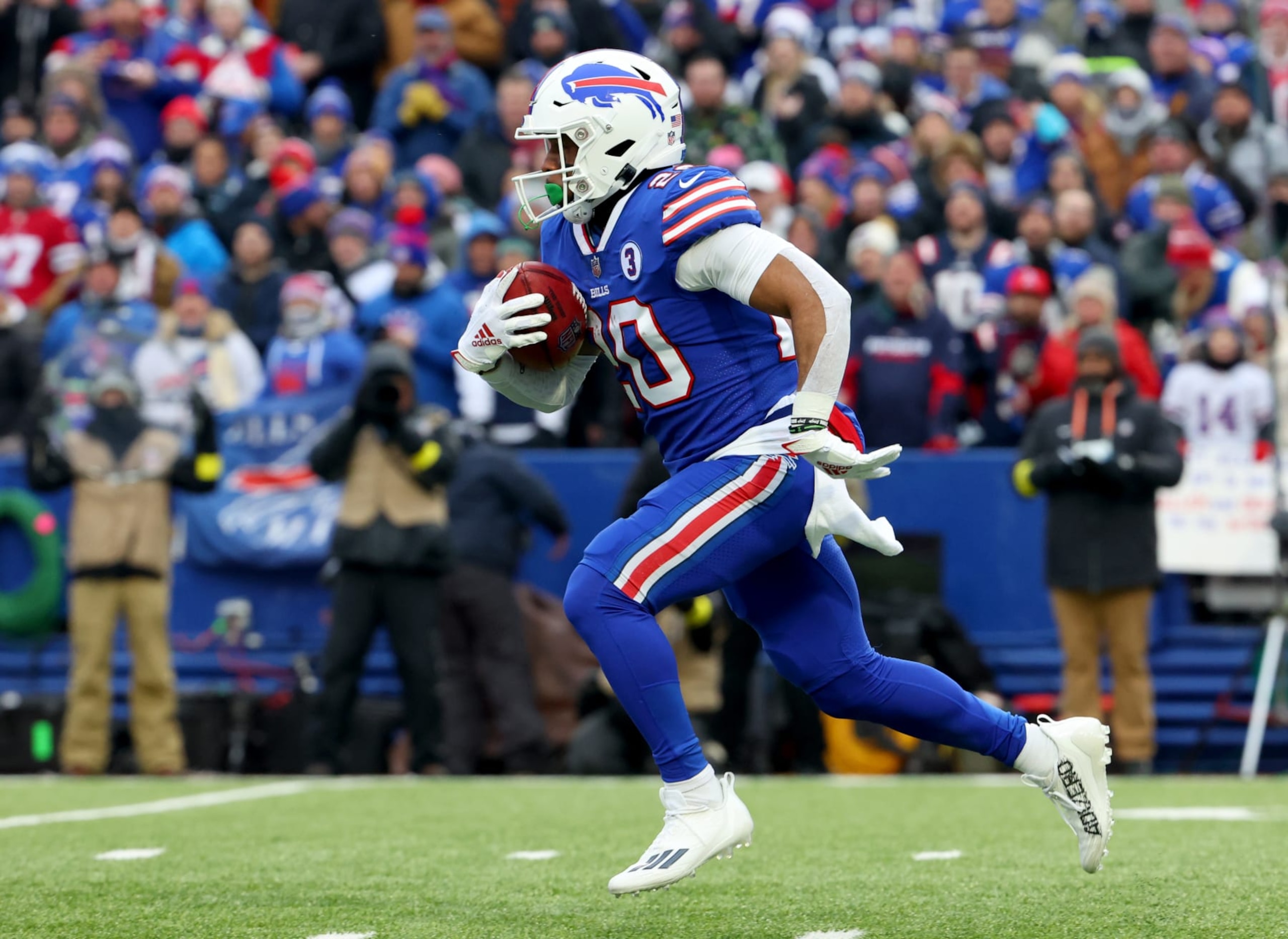 ORCHARD PARK, NY - JANUARY 08: Nyheim Hines #20 of the Buffalo Bills runs the ball on a kickoff against the New England Patriots at Highmark Stadium on January 8, 2023 in Orchard Park, New York. (Photo by Timothy T Ludwig/Getty Images)