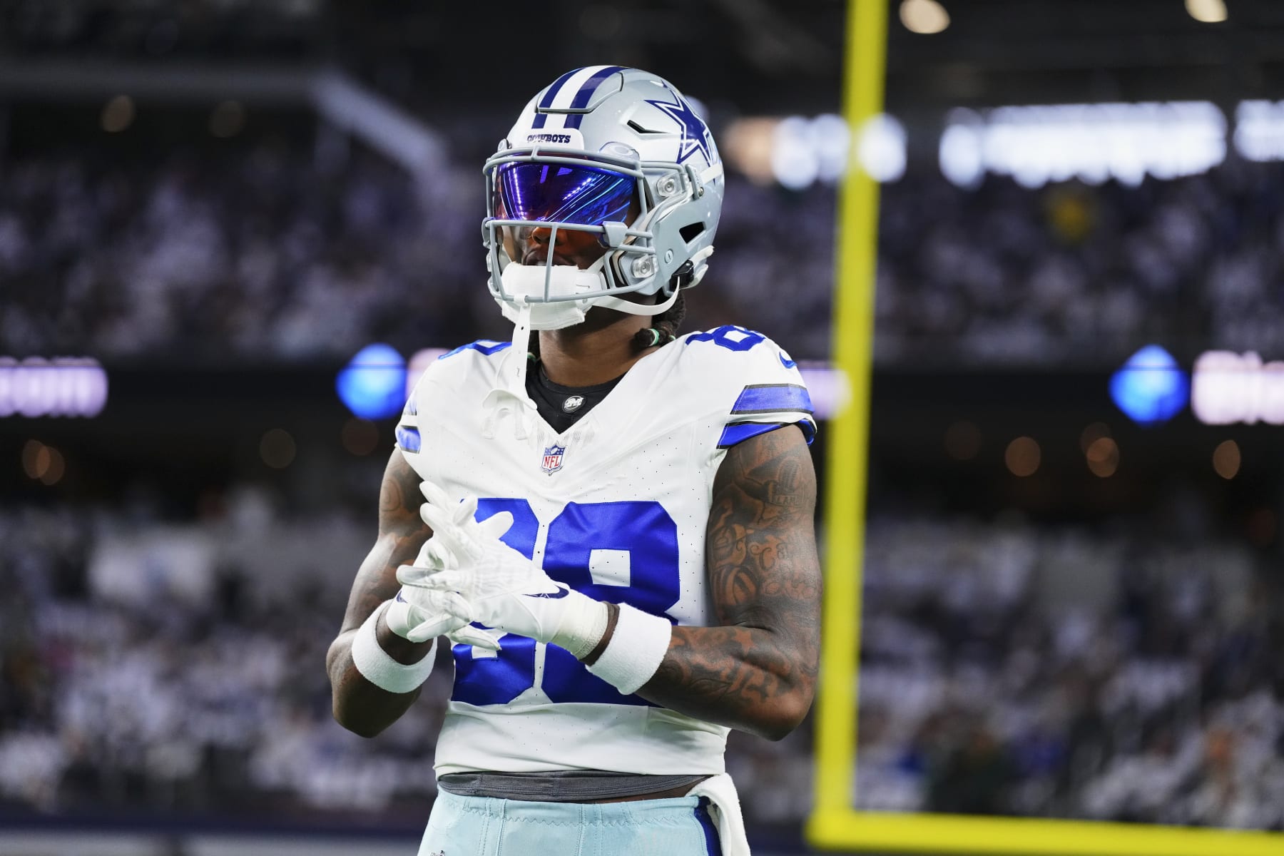 DALLAS, TX - JANUARY 14: CeeDee Lamb #88 of the Dallas Cowboys warms up before kickoff against the Green Bay Packers during the NFC Wild Card playoff game at AT&T Stadium on January 14, 2024 in Dallas, Texas. (Photo by Cooper Neill/Getty Images)