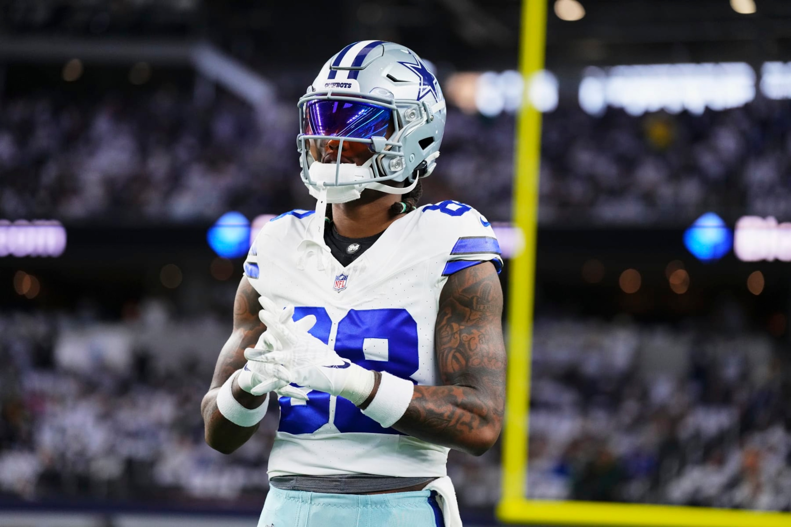 DALLAS, TX - JANUARY 14: CeeDee Lamb #88 of the Dallas Cowboys warms up before kickoff against the Green Bay Packers during the NFC Wild Card playoff game at AT&T Stadium on January 14, 2024 in Dallas, Texas. (Photo by Cooper Neill/Getty Images)