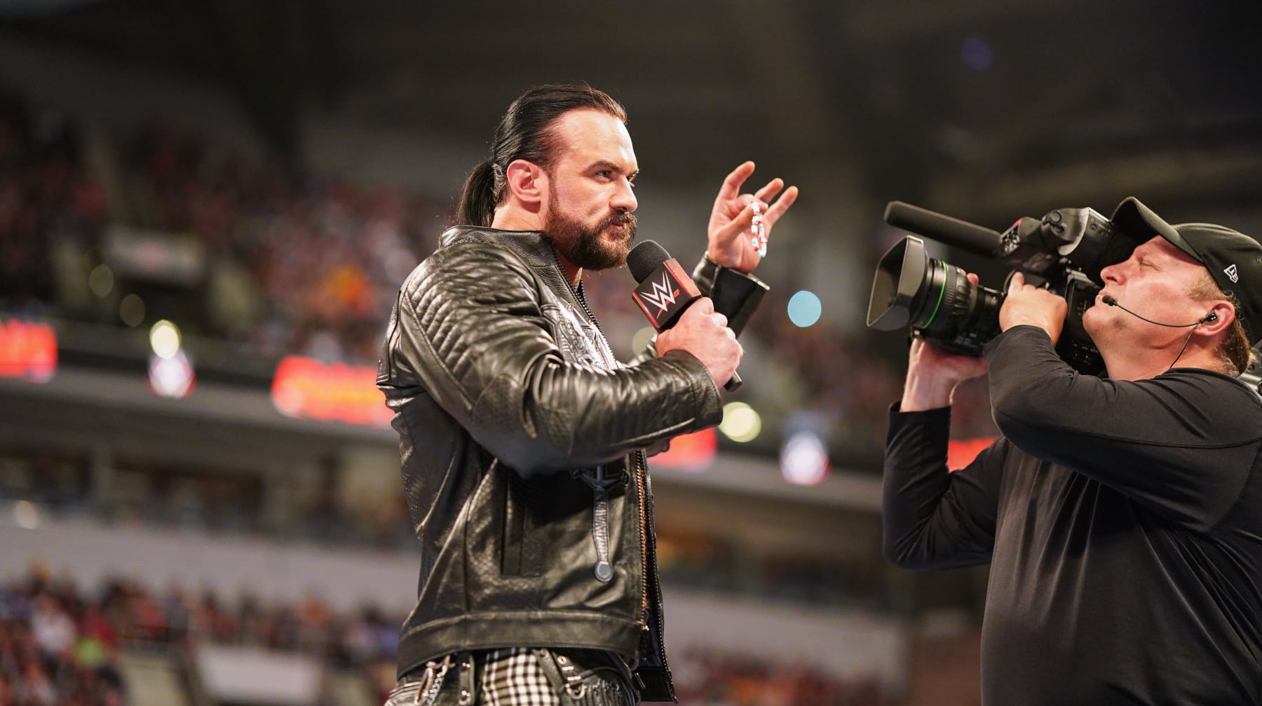INDIANAPOLIS, INDIANA - JUNE 24: Drew McIntyre speaks while holding CM Punk's bracelet during Monday Night RAW at Gainbridge Fieldhouse on June 24, 2024 in Indianapolis, Indiana.  (Photo by WWE/Getty Images)