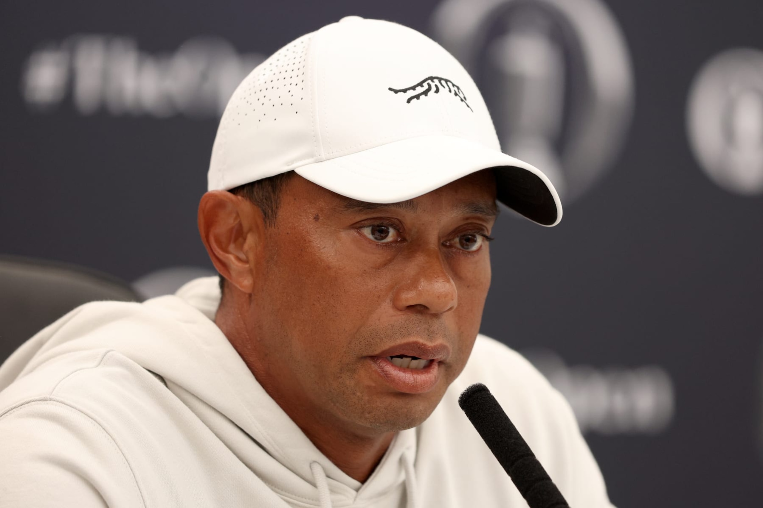 TROON, SCOTLAND - JULY 16: Tiger Woods of the United States talks to the media during a press conference prior to The 152nd Open championship at Royal Troon on July 16, 2024 in Troon, Scotland. (Photo by Warren Little/Getty Images)