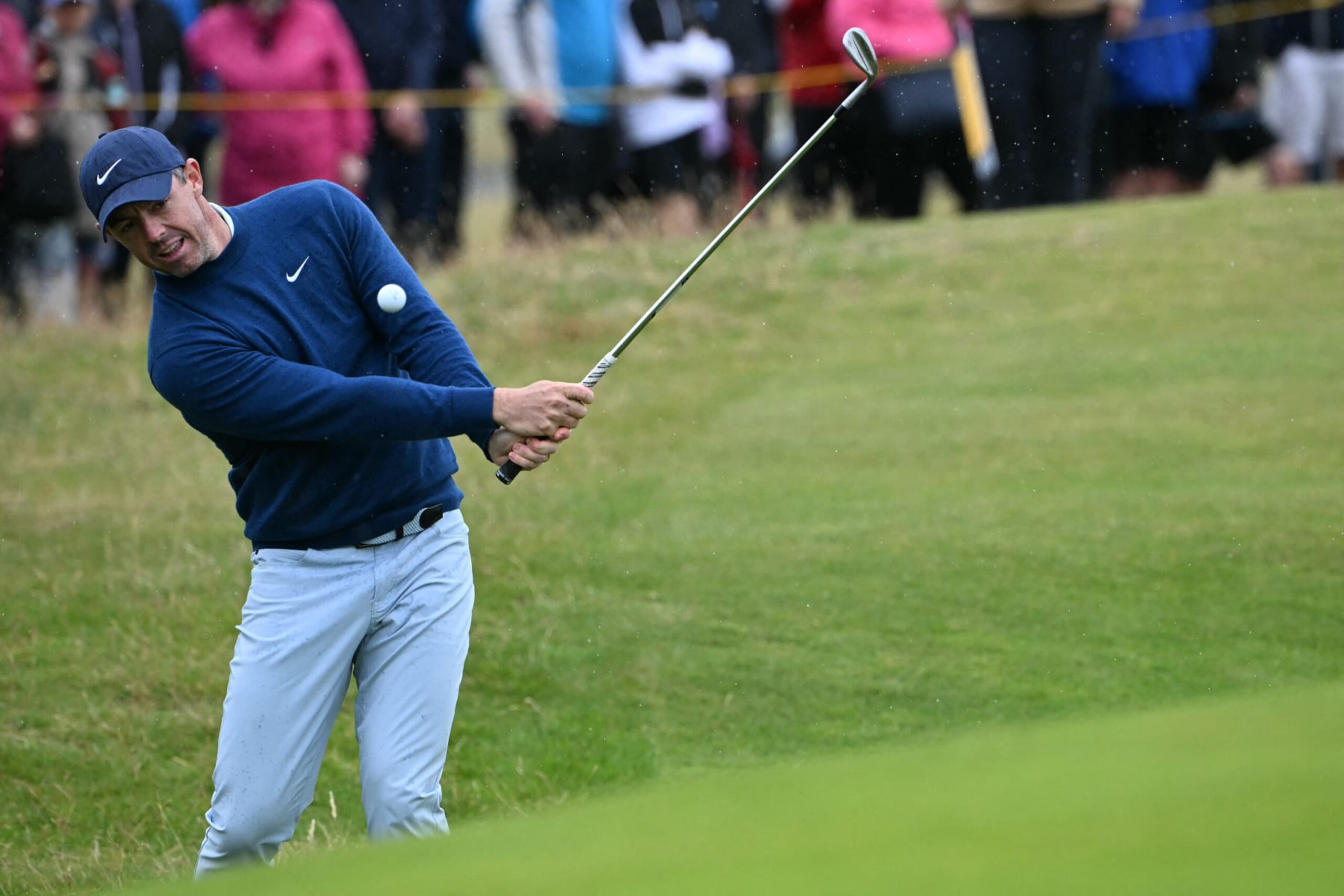 Northern Ireland's Rory McIlroy chips onto the 18th green during a practice round ahead of the 152nd British Open Golf Championship at Royal Troon on the south west coast of Scotland on July 16, 2024. (Photo by ANDY BUCHANAN / AFP) / RESTRICTED TO EDITORIAL USE (Photo by ANDY BUCHANAN/AFP via Getty Images)