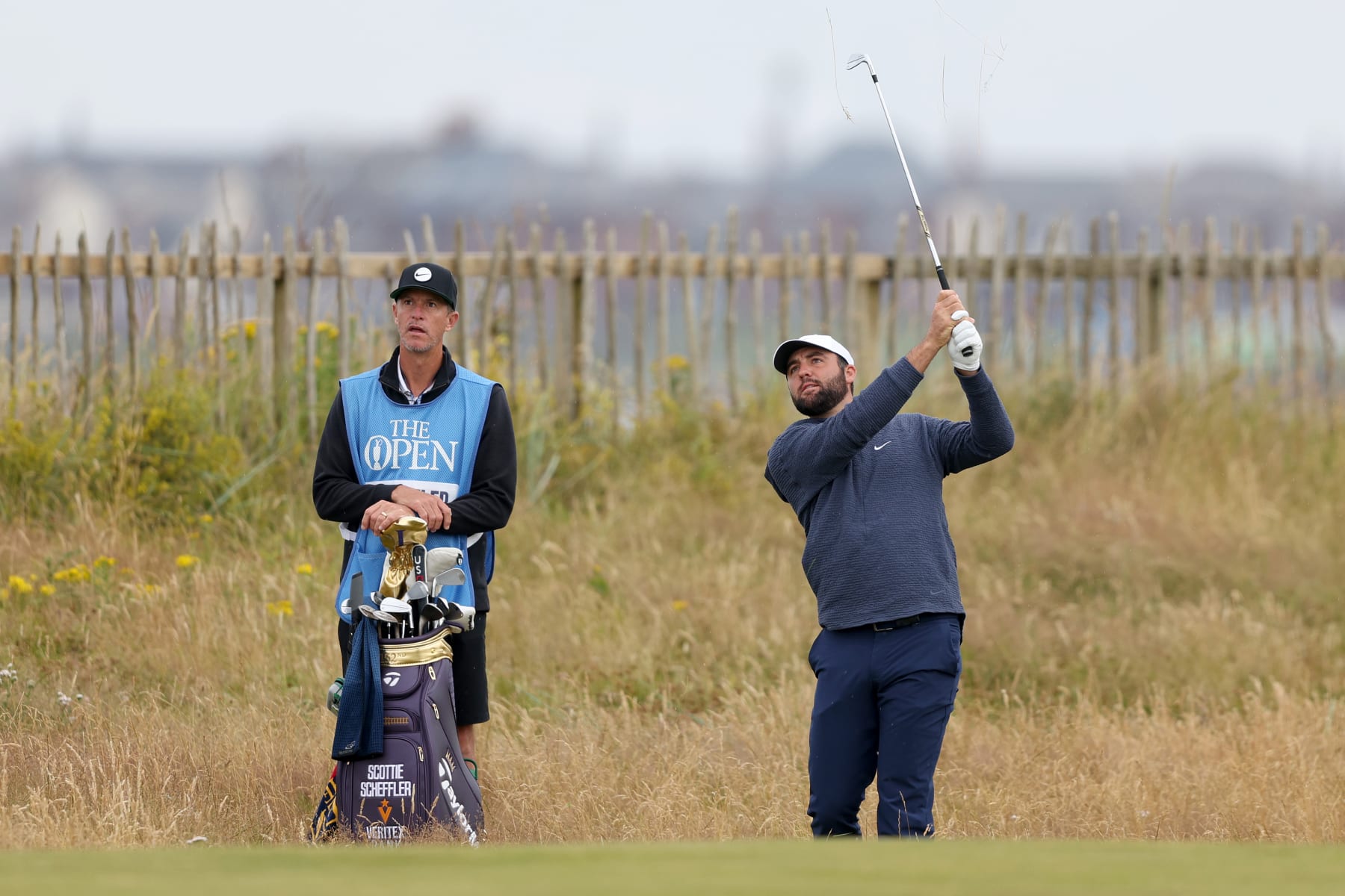 TROON, SCOTLAND - JULY 16: Scottie Scheffler of the United States plays his second shot on the first hole during a practice round prior to The 152nd Open championship at Royal Troon on July 16, 2024 in Troon, Scotland. (Photo by Warren Little/Getty Images)