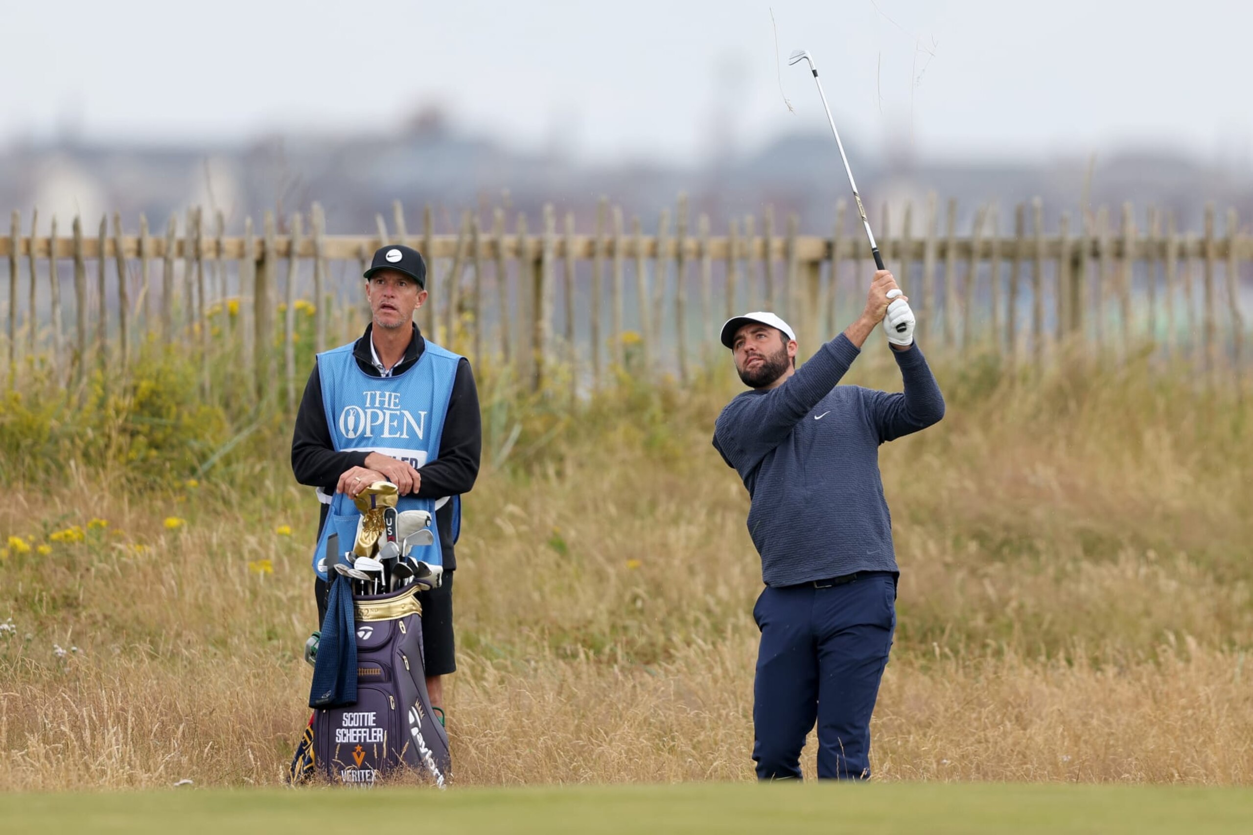 TROON, SCOTLAND - JULY 16: Scottie Scheffler of the United States plays his second shot on the first hole during a practice round prior to The 152nd Open championship at Royal Troon on July 16, 2024 in Troon, Scotland. (Photo by Warren Little/Getty Images)