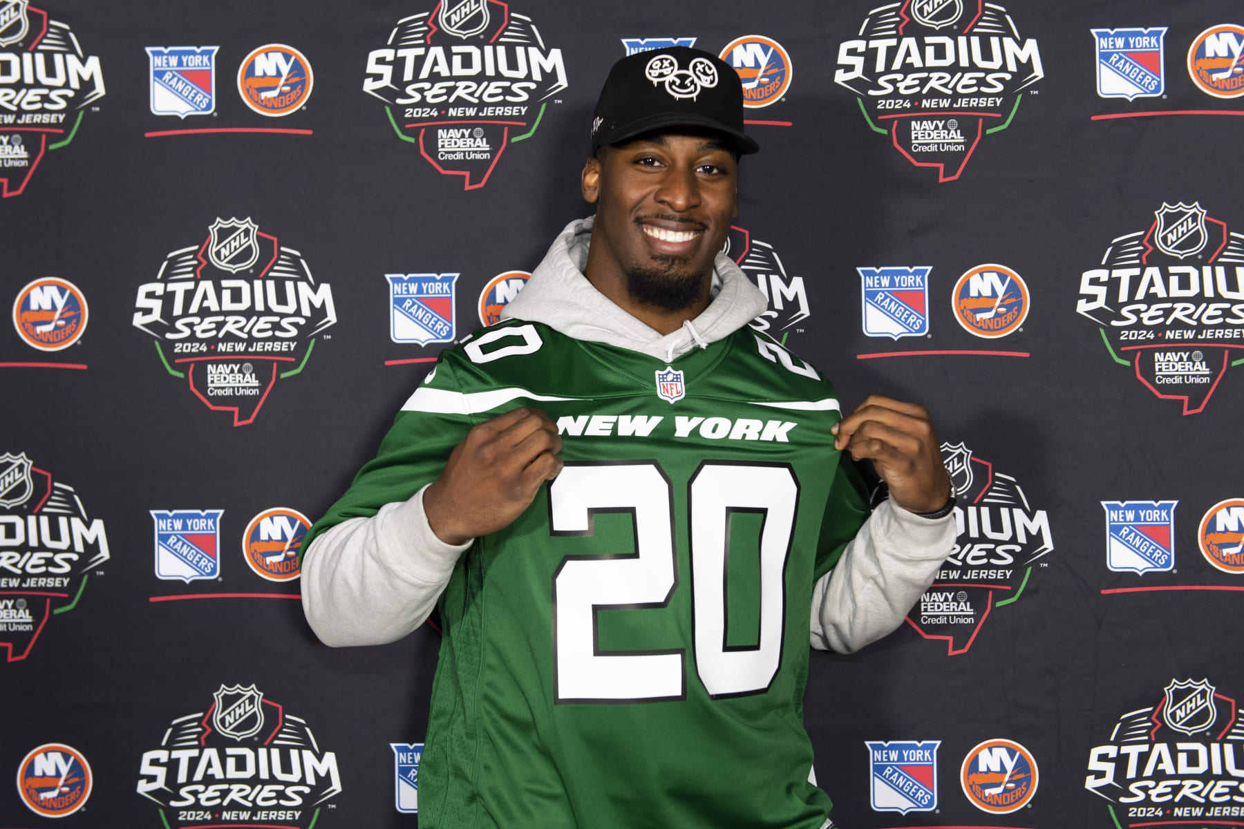 EAST RUTHERFORD, NEW JERSEY - FEBRUARY 18: Breece Hall (20) of the New York Jets is on the step and repeat prior to the game between the New York Rangers and the New York Islanders at MetLife Stadium on February 18, 2024 in East Rutherford, New Jersey. (Photo by Kostas Lymperopoulos/NHLI via Getty Images)