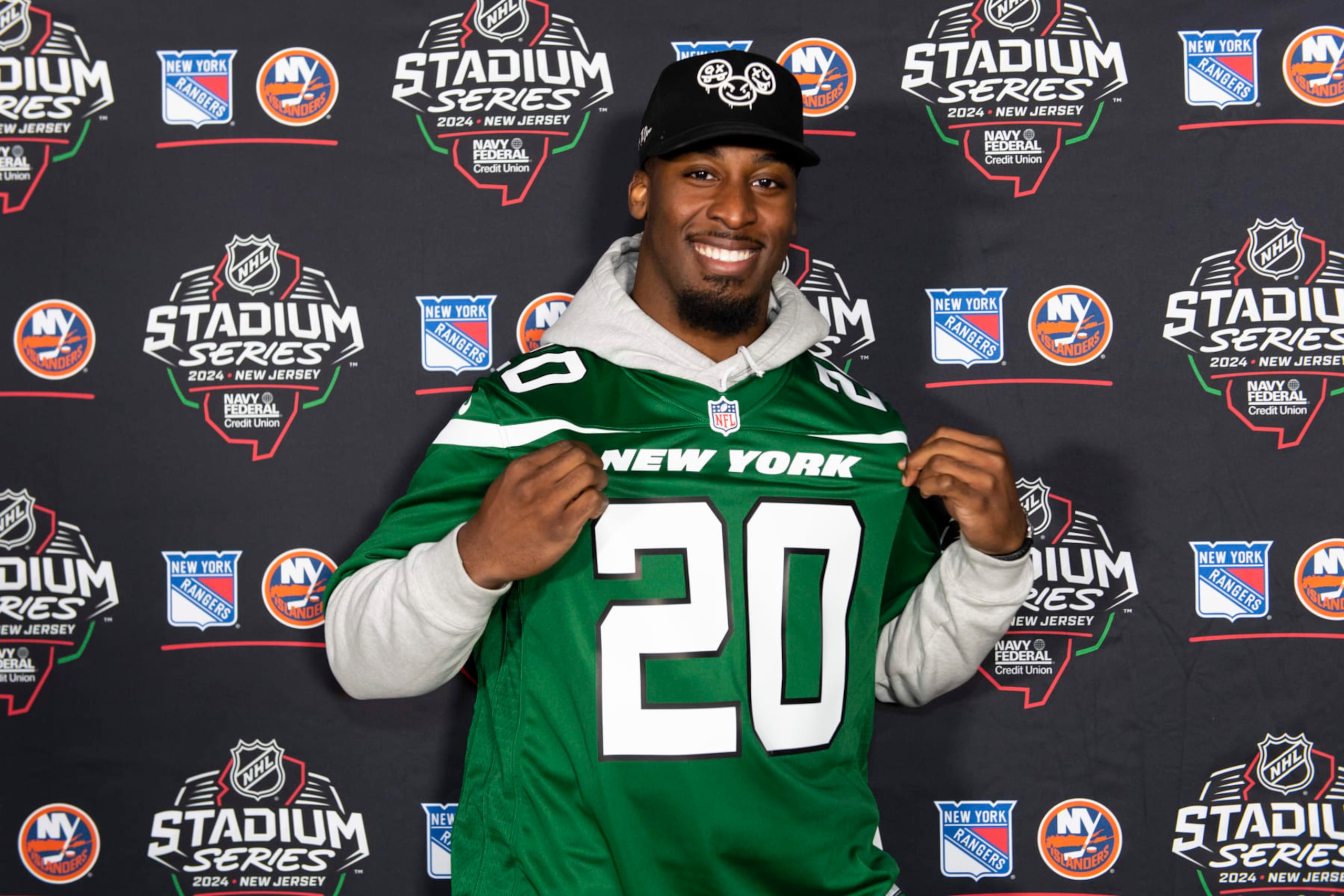 EAST RUTHERFORD, NEW JERSEY - FEBRUARY 18: Breece Hall (20) of the New York Jets is on the step and repeat prior to the game between the New York Rangers and the New York Islanders at MetLife Stadium on February 18, 2024 in East Rutherford, New Jersey. (Photo by Kostas Lymperopoulos/NHLI via Getty Images)