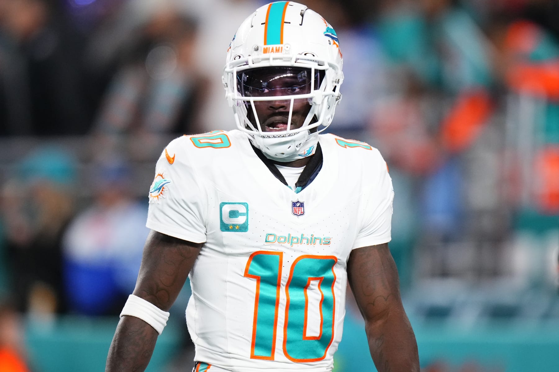 MIAMI GARDENS, FLORIDA - JANUARY 07: Tyreek Hill #10 of the Miami Dolphins warms up prior to a game against the Buffalo Bills at Hard Rock Stadium on January 07, 2024 in Miami Gardens, Florida. (Photo by Rich Storry/Getty Images)