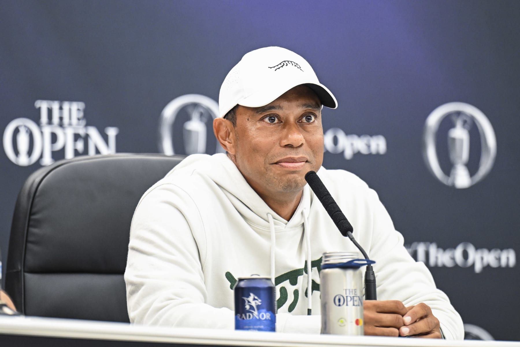 TROON, SCOTLAND - JULY 16:  Tiger Woods smiles at a press conference during practice for The 152nd Open Championship at Royal Troon on July 16, 2024 in Troon, Scotland. (Photo by Keyur Khamar/PGA TOUR via Getty Images)