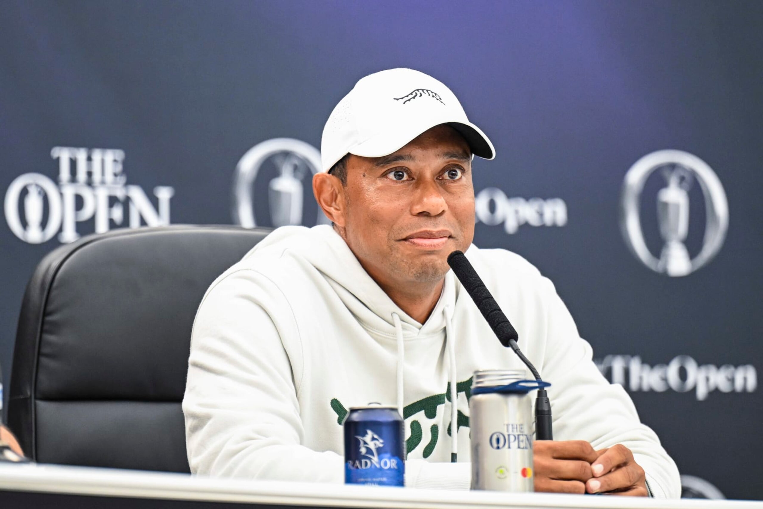 TROON, SCOTLAND - JULY 16: Tiger Woods smiles at a press conference during practice for The 152nd Open Championship at Royal Troon on July 16, 2024 in Troon, Scotland. (Photo by Keyur Khamar/PGA TOUR via Getty Images) TROON, SCOTLAND - JULY 16: Tiger Woods smiles at a press conference during practice for The 152nd Open Championship at Royal Troon on July 16, 2024 in Troon, Scotland. (Photo by Keyur Khamar/PGA TOUR via Getty Images)