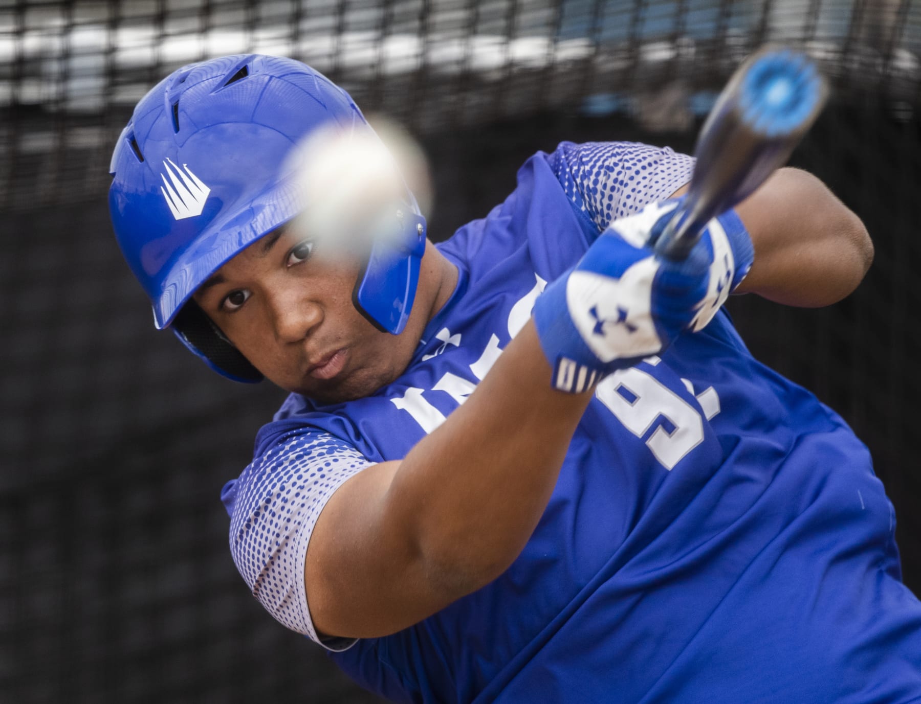 BRADENTON, FL - JANUARY 29: D'Angelo Ortiz drills the ball during IMG Academy batting practice in Bradenton, FL on Jan. 29, 2020. Big papi David Ortiz's son is now a strapping 6-foot-1-inch, 225-pound third baseman who has adopted the batting stance of his famous father and will don his No. 34 when the season starts. He wears a Red Sox Nation and a Believe wristband and is sporting a gold necklace that he borrowed from his father. (Photo by Stan Grossfeld/The Boston Globe via Getty Images) BRADENTON, FL - JANUARY 29: D'Angelo Ortiz drills the ball during IMG Academy batting practice in Bradenton, FL on Jan. 29, 2020. Big papi David Ortiz's son is now a strapping 6-foot-1-inch, 225-pound third baseman who has adopted the batting stance of his famous father and will don his No. 34 when the season starts. He wears a Red Sox Nation and a Believe wristband and is sporting a gold necklace that he borrowed from his father. (Photo by Stan Grossfeld/The Boston Globe via Getty Images)