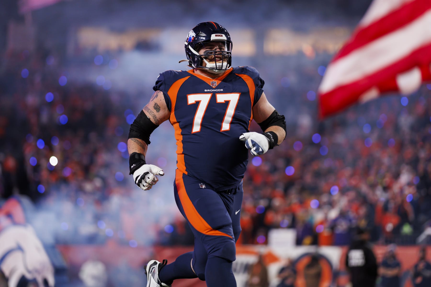 DENVER, COLORADO - NOVEMBER 19: Quinn Meinerz #77 of the Denver Broncos runs onto the field during player introductions before an NFL football game against the Minnesota Vikings at Empower Field at Mile High on November 19, 2023 in Denver, Colorado. (Photo by Ryan Kang/Getty Images)