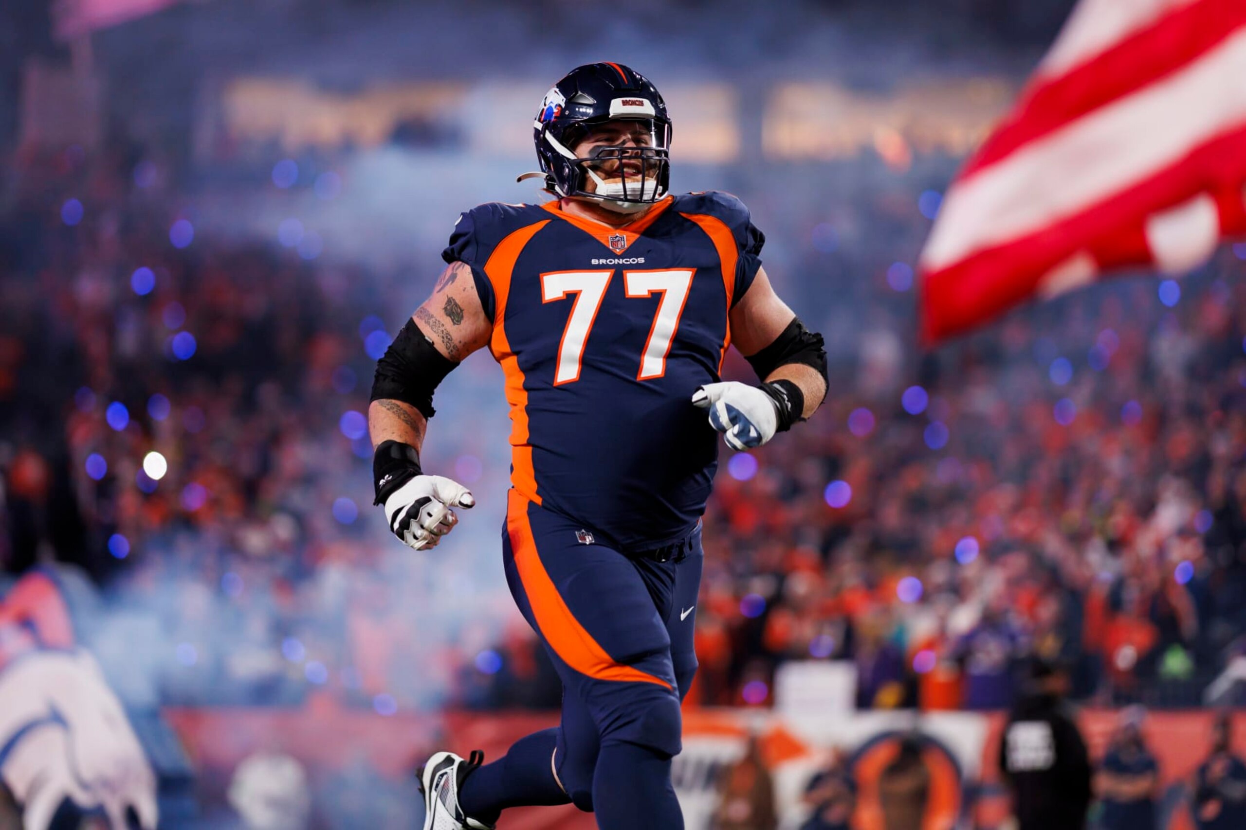 DENVER, COLORADO - NOVEMBER 19: Quinn Meinerz #77 of the Denver Broncos runs onto the field during player introductions before an NFL football game against the Minnesota Vikings at Empower Field at Mile High on November 19, 2023 in Denver, Colorado. (Photo by Ryan Kang/Getty Images)