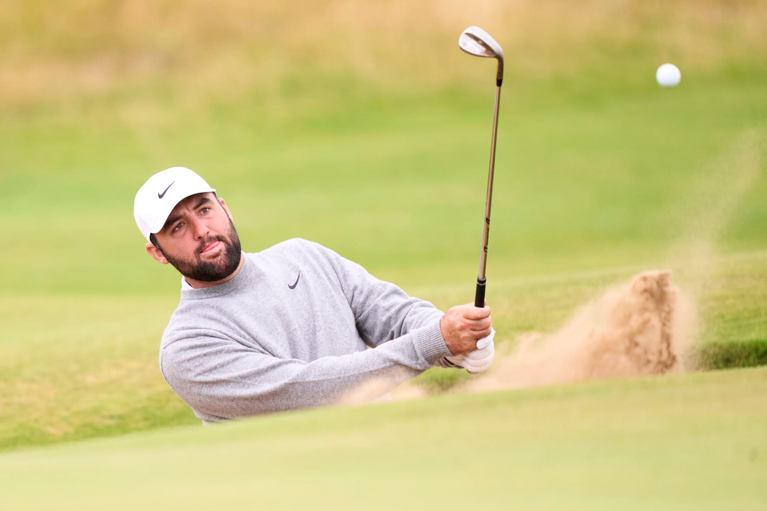 TROON, SCOTLAND - JULY 17: Scottie Scheffler of United States in action during a practice round prior to The 152nd Open championship at Royal Troon on July 17, 2024 in Troon, Scotland. (Photo by Pedro Salado/Getty Images) TROON, SCOTLAND - JULY 17: Scottie Scheffler of United States in action during a practice round prior to The 152nd Open championship at Royal Troon on July 17, 2024 in Troon, Scotland. (Photo by Pedro Salado/Getty Images)
