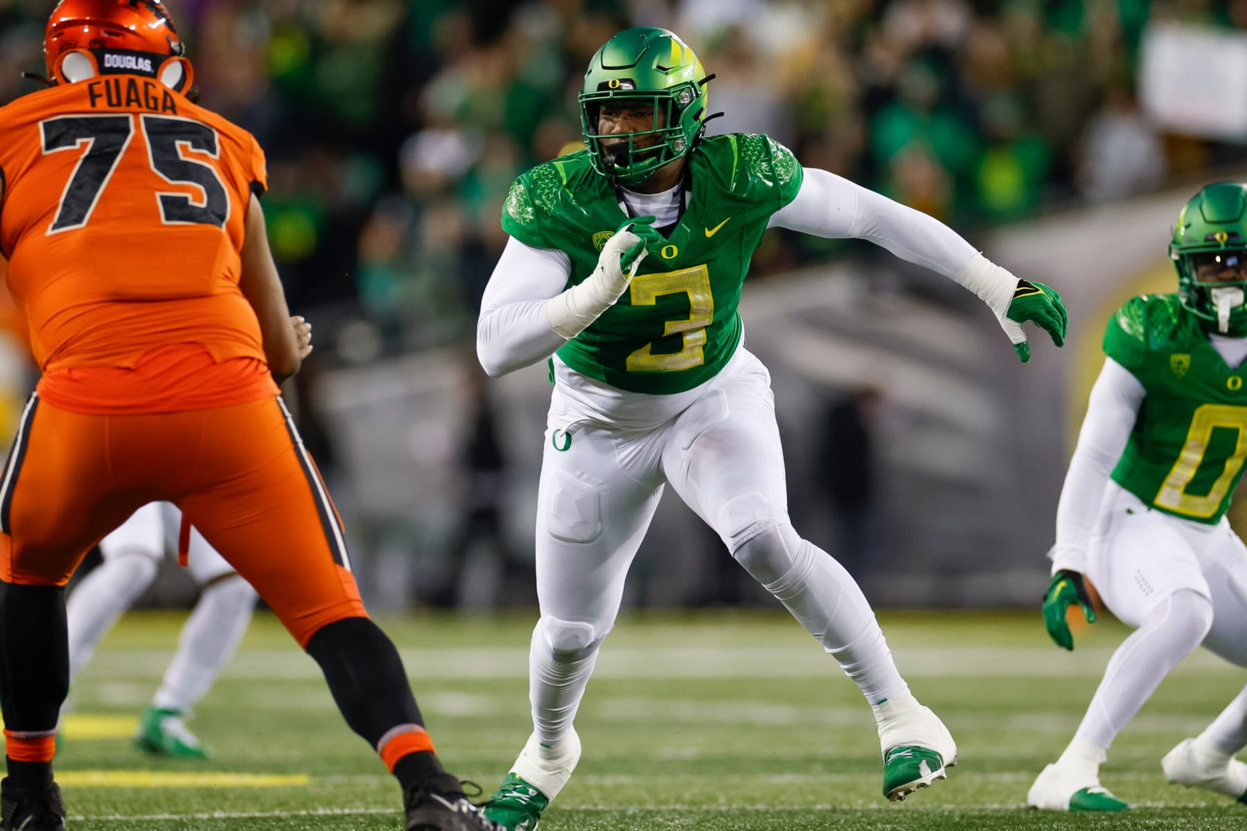 EUGENE, OREGON - NOVEMBER 24: Brandon Dorlus #3 of the Oregon Ducks rushes the edge in the first half during a game against the Oregon State Beavers at Autzen Stadium on November 24, 2023 in Eugene, Oregon. (Photo by Brandon Sloter/Image Of Sport/Getty Images)