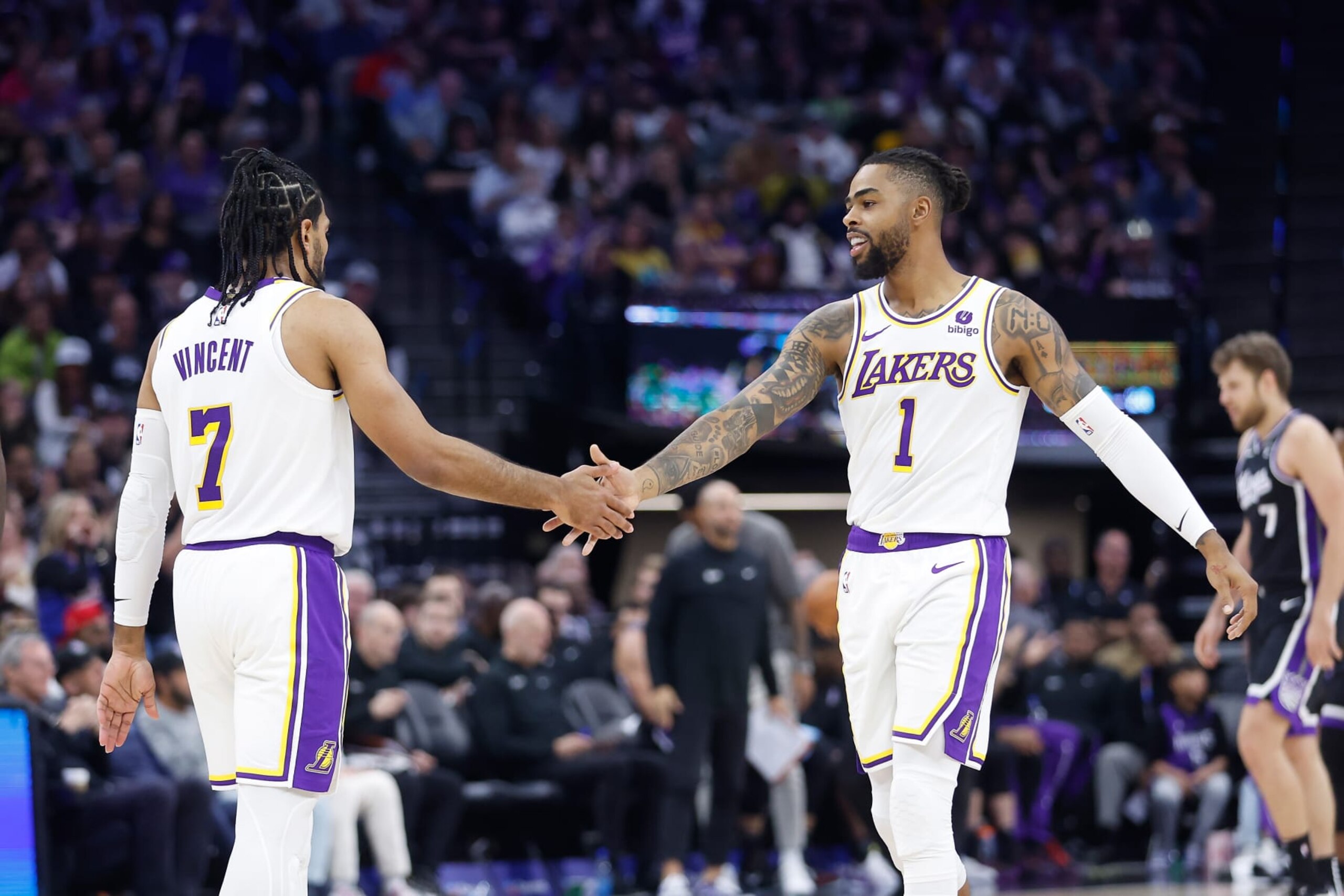 SACRAMENTO, CALIFORNIA - OCTOBER 29: D'Angelo Russell #1 of the Los Angeles Lakers reacts after a play with Gabe Vincent #7 in the third quarter against the Sacramento Kings at Golden 1 Center on October 29, 2023 in Sacramento, California. NOTE TO USER: User expressly acknowledges and agrees that, by downloading and or using this photograph, User is consenting to the terms and conditions of the Getty Images License Agreement. (Photo by Lachlan Cunningham/Getty Images)
