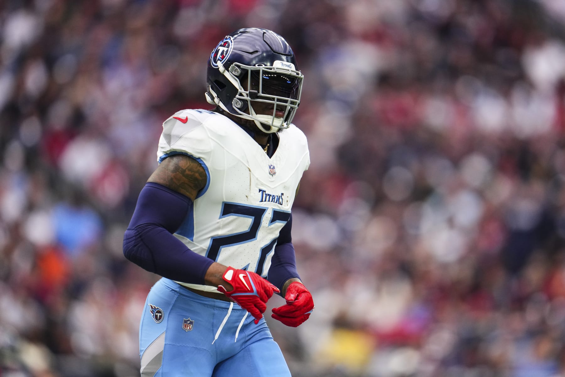 HOUSTON, TX - DECEMBER 31: Derrick Henry #22 of the Tennessee Titans looks on from the field during an NFL football game against the Houston Texans at NRG Stadium on December 31, 2023 in Houston, Texas. (Photo by Cooper Neill/Getty Images)