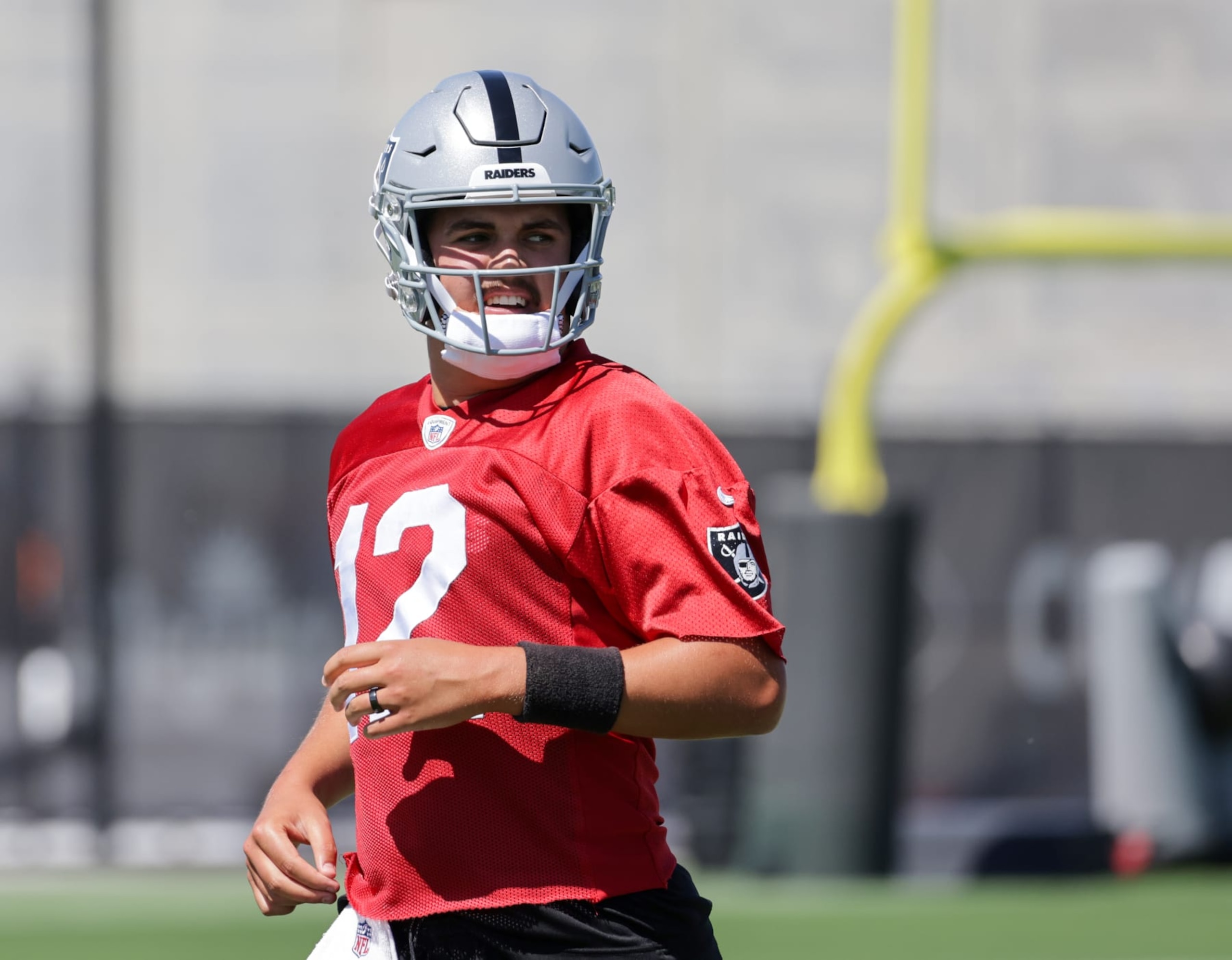 HENDERSON, NEVADA - MAY 29: Quarterback Aidan O'Connell #12 of the Las Vegas Raiders runs through a drill during an OTA offseason workout at the Las Vegas Raiders Headquarters/Intermountain Healthcare Performance Center on May 29, 2024 in Henderson, Nevada. (Photo by Ethan Miller/Getty Images)