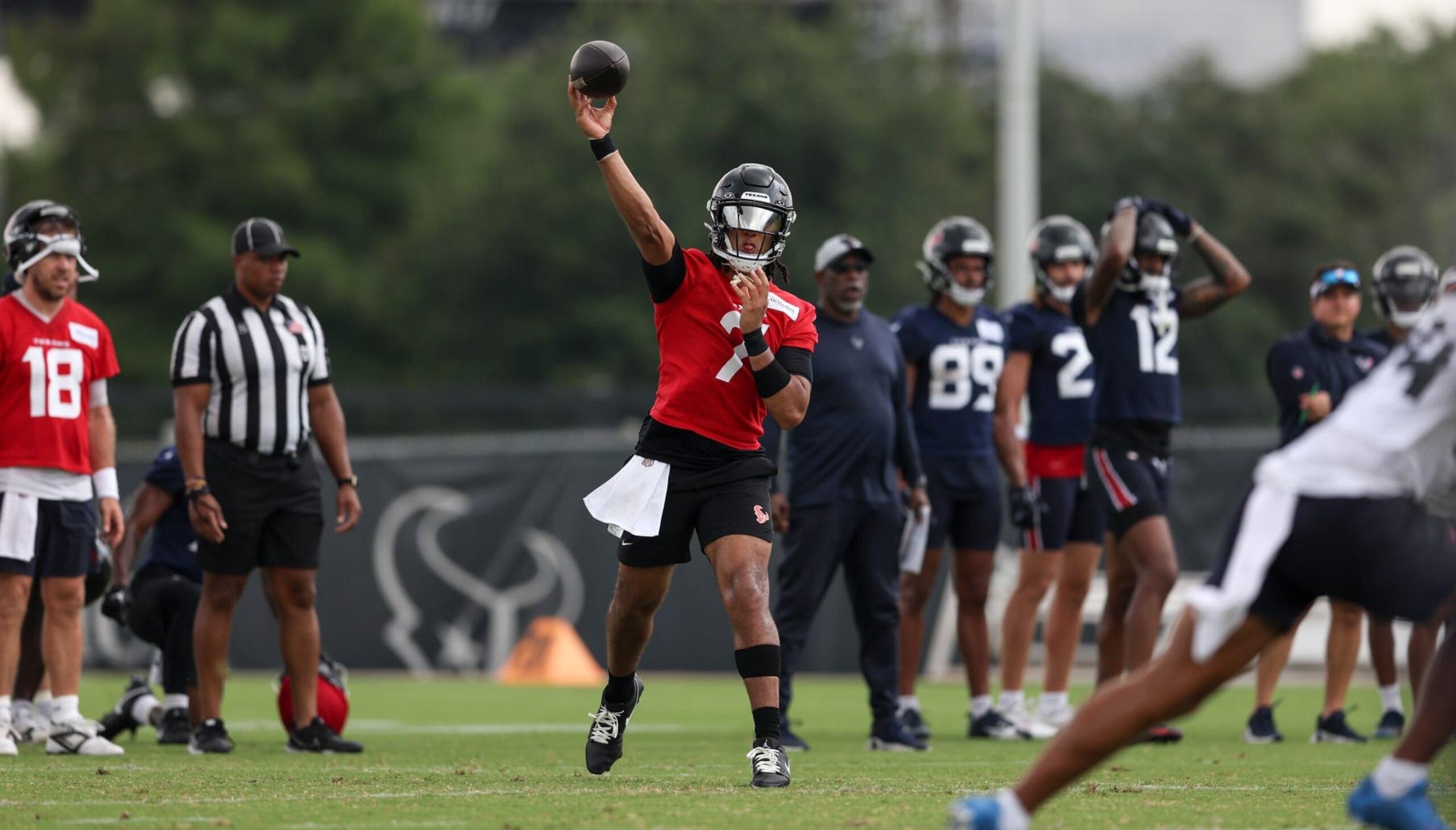 HOUSTON, TEXAS - JUNE 04: C.J. Stroud #7 of the Houston Texans throws a pass during Mandatory Minicamp at Houston Methodist Training Center on June 04, 2024 in Houston, Texas. (Photo by Tim Warner/Getty Images)