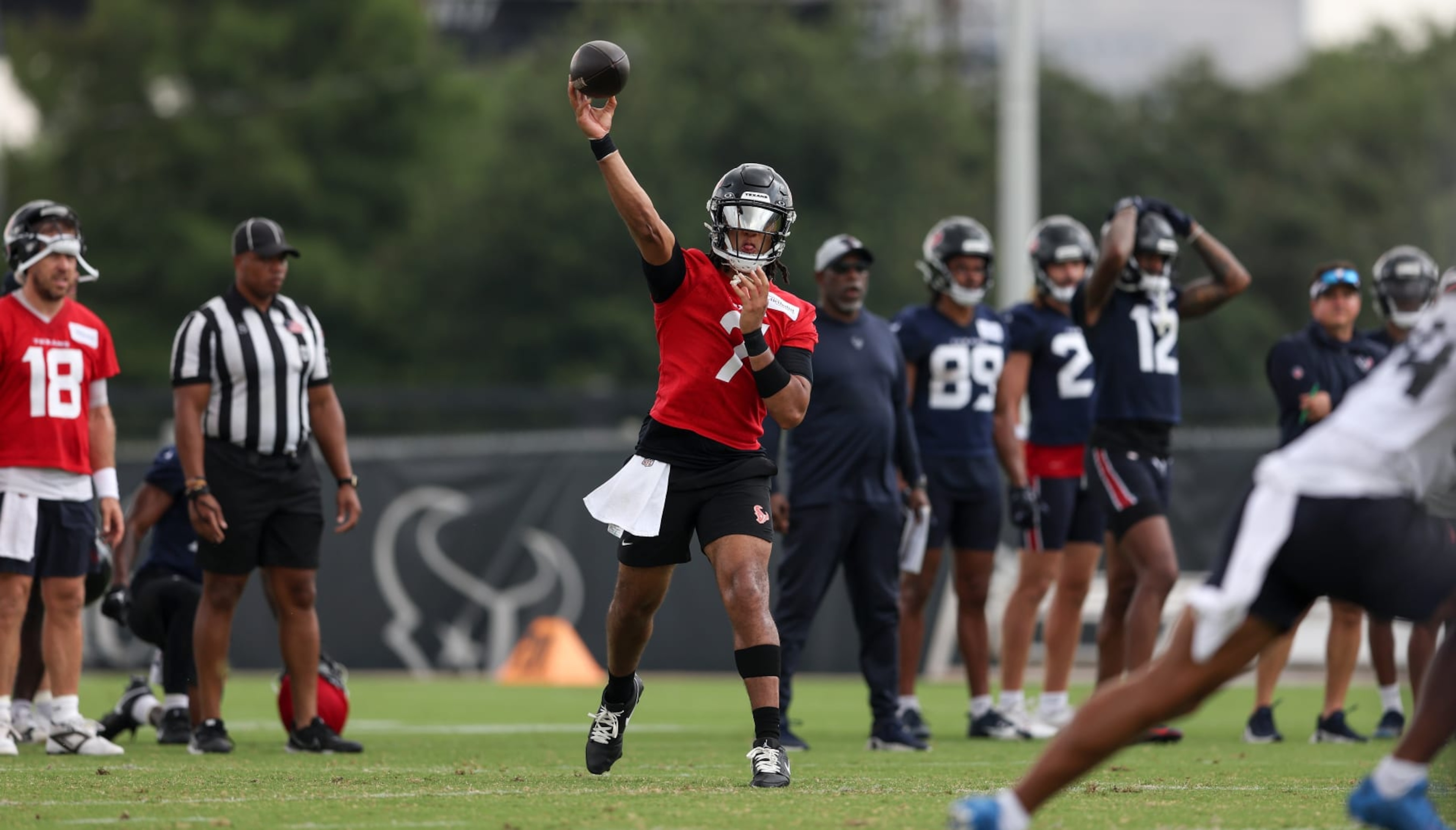 HOUSTON, TEXAS - JUNE 04: C.J. Stroud #7 of the Houston Texans throws a pass during Mandatory Minicamp at Houston Methodist Training Center on June 04, 2024 in Houston, Texas. (Photo by Tim Warner/Getty Images)