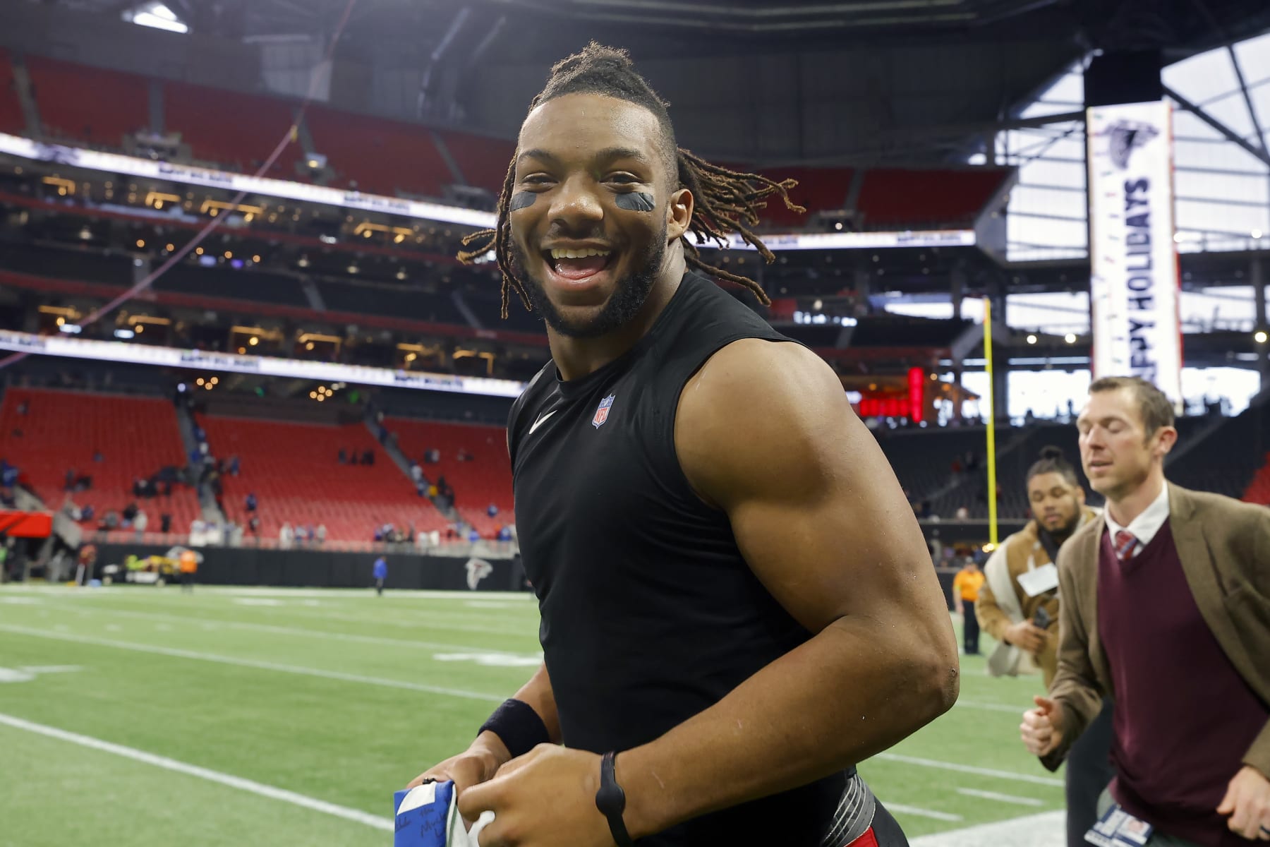 ATLANTA, GEORGIA - DECEMBER 24: Bijan Robinson #7 of the Atlanta Falcons runs on the field after a win over the Indianapolis Colts at Mercedes-Benz Stadium on December 24, 2023 in Atlanta, Georgia. (Photo by Todd Kirkland/Getty Images)