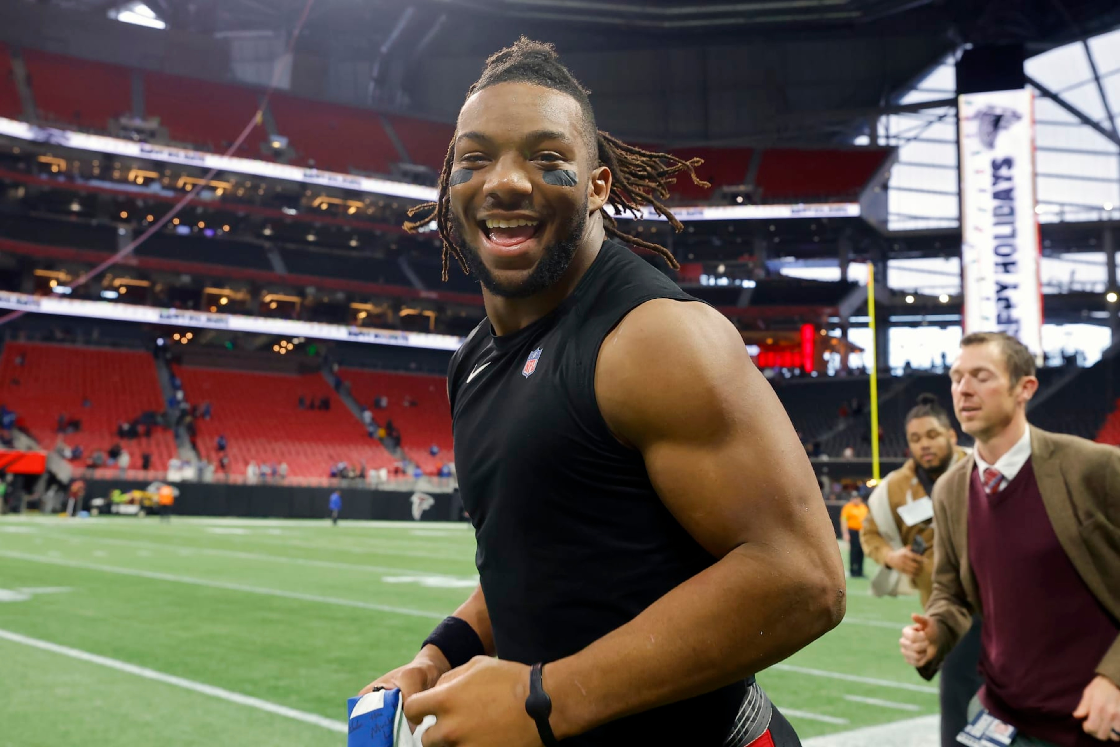 ATLANTA, GEORGIA - DECEMBER 24: Bijan Robinson #7 of the Atlanta Falcons runs on the field after a win over the Indianapolis Colts at Mercedes-Benz Stadium on December 24, 2023 in Atlanta, Georgia. (Photo by Todd Kirkland/Getty Images) ATLANTA, GEORGIA - DECEMBER 24: Bijan Robinson #7 of the Atlanta Falcons runs on the field after a win over the Indianapolis Colts at Mercedes-Benz Stadium on December 24, 2023 in Atlanta, Georgia. (Photo by Todd Kirkland/Getty Images)