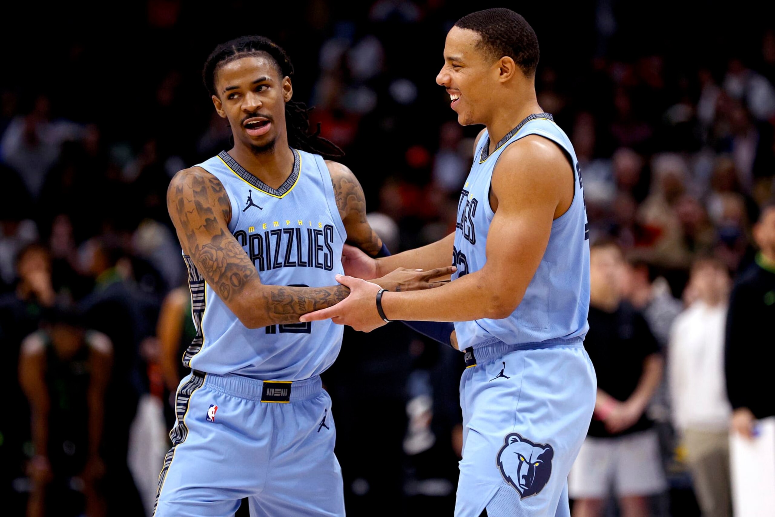 NEW ORLEANS, LOUISIANA - DECEMBER 26: Ja Morant #12 of the Memphis Grizzlies reacts with Desmond Bane #22 of the Memphis Grizzlies during overtime of an NBA game against the New Orleans Pelicans at Smoothie King Center on December 26, 2023 in New Orleans, Louisiana. The Memphis Grizzlies won the game 116 - 115 over the New Orleans Pelicans. NOTE TO USER: User expressly acknowledges and agrees that, by downloading and or using this photograph, User is consenting to the terms and conditions of the Getty Images License Agreement. (Photo by Sean Gardner/Getty Images) NEW ORLEANS, LOUISIANA - DECEMBER 26: Ja Morant #12 of the Memphis Grizzlies reacts with Desmond Bane #22 of the Memphis Grizzlies during overtime of an NBA game against the New Orleans Pelicans at Smoothie King Center on December 26, 2023 in New Orleans, Louisiana. The Memphis Grizzlies won the game 116 - 115 over the New Orleans Pelicans. NOTE TO USER: User expressly acknowledges and agrees that, by downloading and or using this photograph, User is consenting to the terms and conditions of the Getty Images License Agreement. (Photo by Sean Gardner/Getty Images)