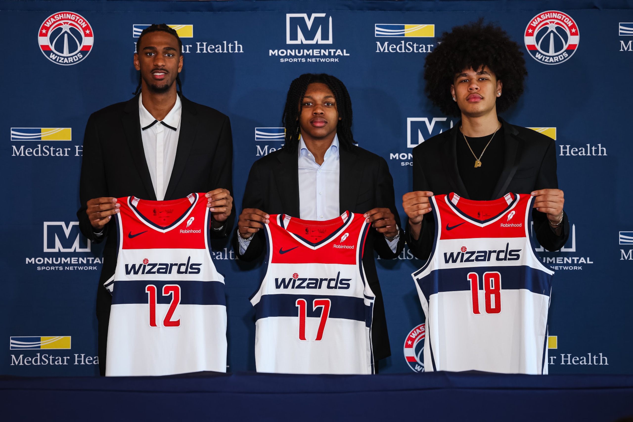 WASHINGTON, DC - JUNE 29: (L-R) 2024 draft picks Alex Sarr #12, Bub Carrington #17, and Kyshawn George #18 of the Washington Wizards are introduced at Union Station on June 29, 2024 in Washington, DC. NOTE TO USER: User expressly acknowledges and agrees that, by downloading and or using this photograph, User is consenting to the terms and conditions of the Getty Images License Agreement. (Photo by Scott Taetsch/Getty Images)