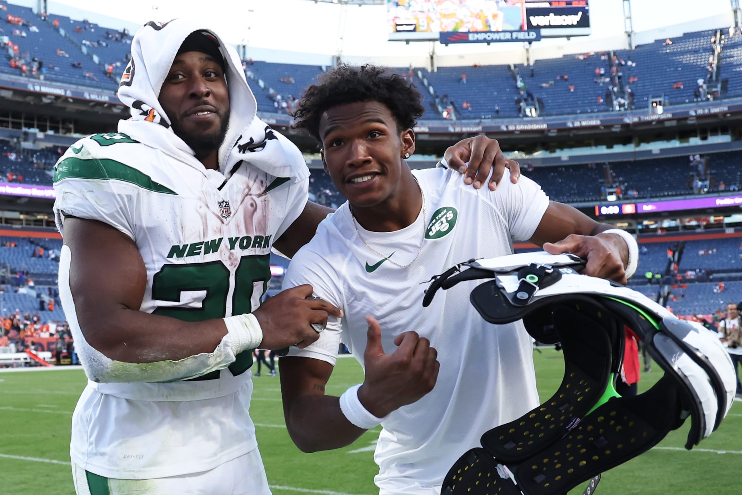 DENVER, COLORADO - OCTOBER 08: Breece Hall #20 and Garrett Wilson #17 of the New York Jets celebrate after beating the Denver Broncos 31-21 at Empower Field At Mile High on October 08, 2023 in Denver, Colorado. (Photo by Matthew Stockman/Getty Images)