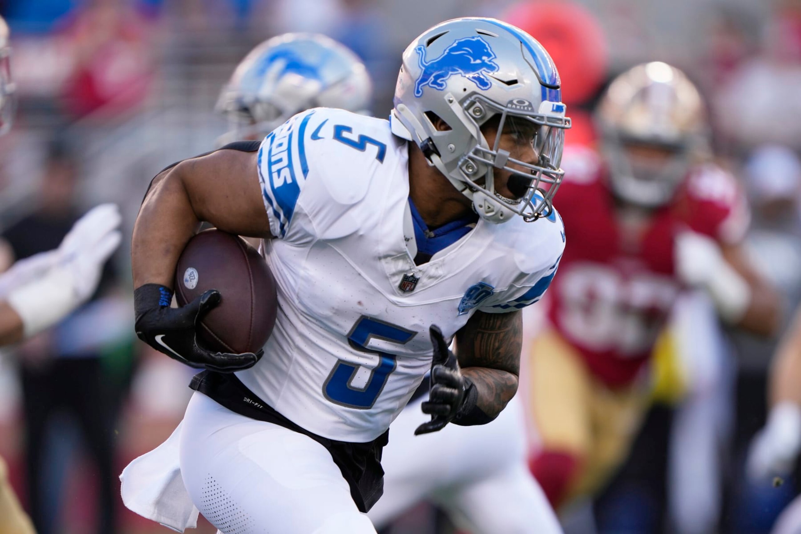SANTA CLARA, CALIFORNIA - JANUARY 28: David Montgomery #5 of the Detroit Lions runs the ball during the first quarter against the San Francisco 49ers in the NFC Championship Game at Levi's Stadium on January 28, 2024 in Santa Clara, California. (Photo by Thearon W. Henderson/Getty Images)